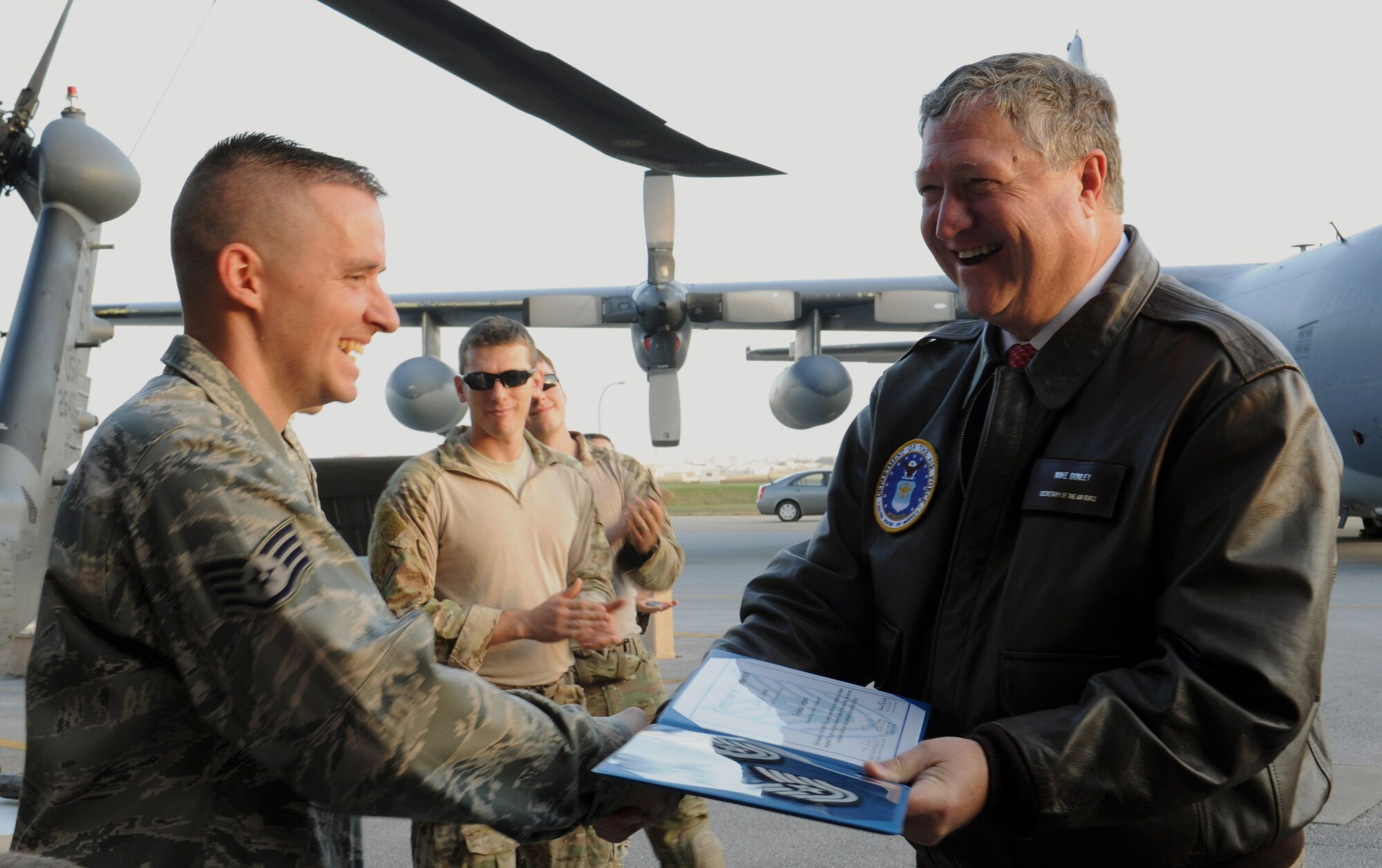 U.S. Air Force Staff Sgt. Kevin Fansler, 718th Aircraft Maintenance Squadron HH-60G Pave Hawk flying crew chief, receives a stripe for exceptional performance from Secretary of the Air Force Michael Donley on Kadena Air Base, Japan, Nov. 20, 2012. Tech. Sgt. Jeremy Mitchell and Staff Sgt. Luther Gourdine, both of the 718th Civil Engineer Squadron, were also STEP promoted by Donley. (U.S. Air Force photo/Airman 1st Class Malia Jenkins)
