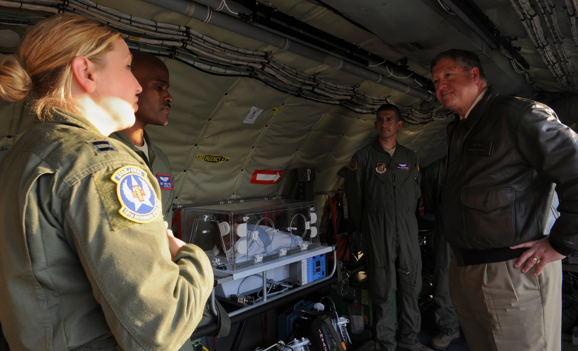 U.S. Air Force Capt. Randi Ewing, 18th Aeromedical Evacuation Squadron flight nurse, gives Secretary of the Air Force Michael Donley a briefing about aeromedical evacuation on Kadena Air Base, Japan, Nov. 20, 2012. Donley visited with Kadena Shoguns as part of a multi-day tour to the Pacific. During his tour he visited the Erwin Professional Military Education Center, the Airmen and Family Readiness Center and the Wired Bean to see how well Kadena takes care of its Airmen both on and off duty. (U.S. Air Force photo/Airman 1st Class Malia Jenkins)