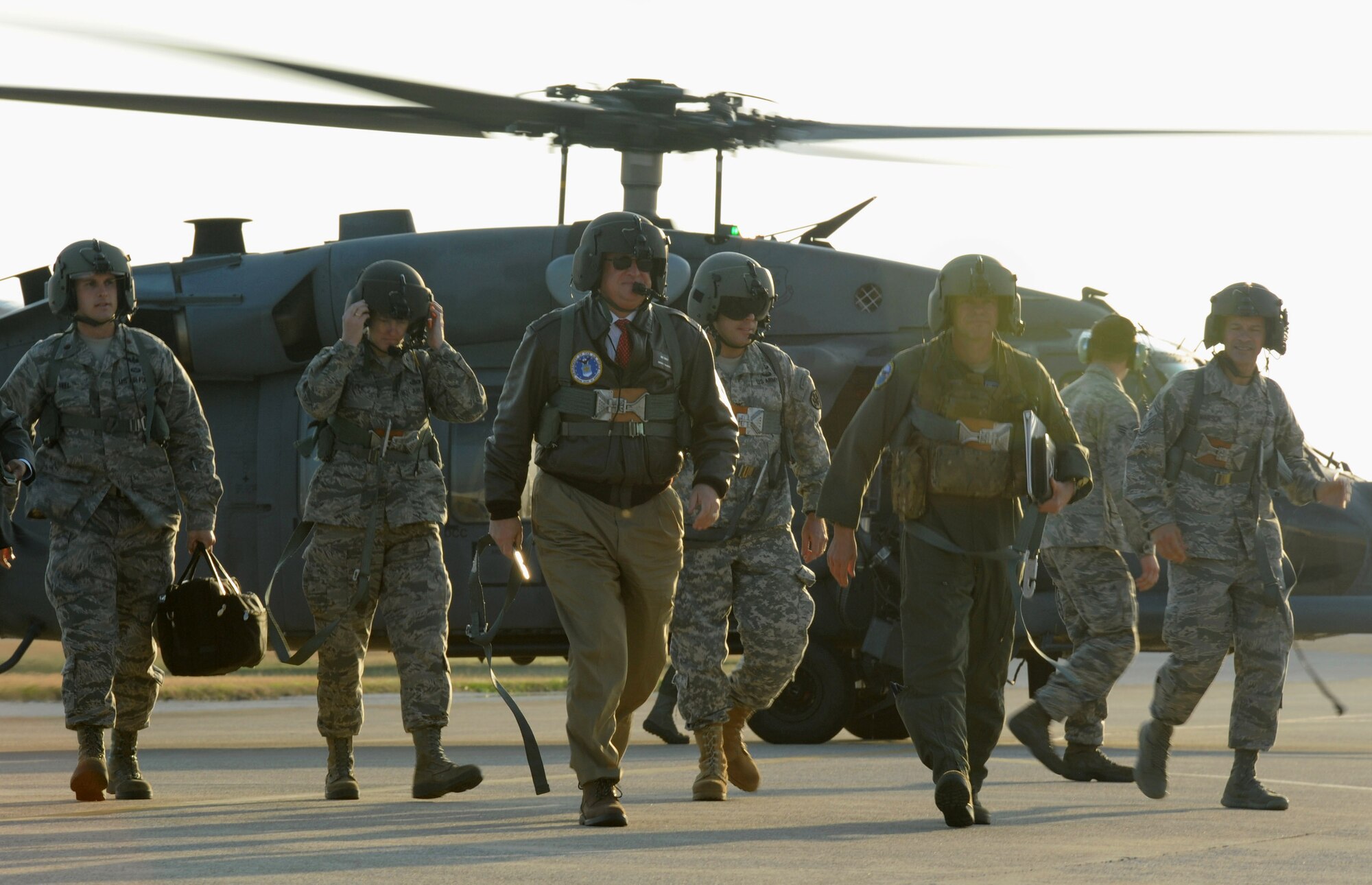 Secretary of the Air Force Michael Donley completes a flight aboard a HH-60G Pave Hawk on Kadena Air Base, Japan, Nov. 20, 2012. Donley visited with Kadena Shoguns as part of a multi-day tour to the Pacific. During his tourhe visited the Erwin  Professional Military Education Center, the Airmen and Family Readiness Center and the Wired Bean to see how well Kadena takes care of its Airmen both on and off duty.(U.S. Air Force photo/Airman 1st Class Malia Jenkins)