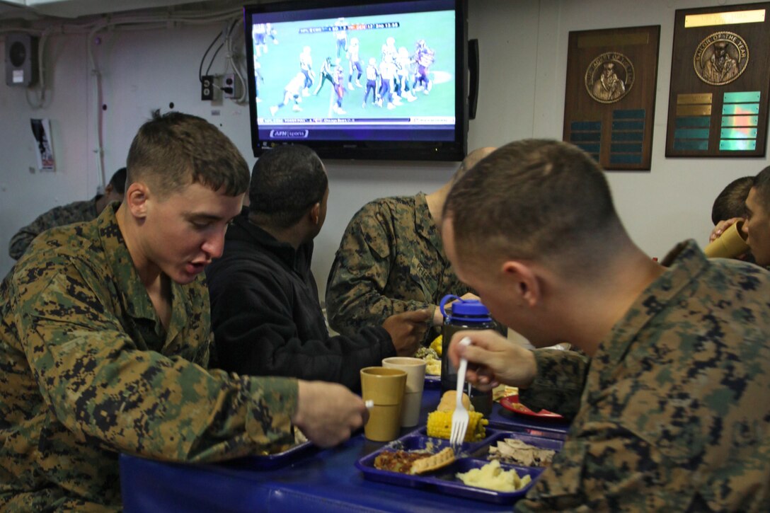 Marines with the 24th Marine Expeditionary Unit enjoy a Thanksgiving feast aboard the USS New York, Nov. 22, 2012. All three ships of the Iwo Jima Amphibious Ready Group served Thanksgiving dinner to their crew. The 24th Marine Expeditionary Unit is currently deployed as an expeditionary crisis response force in support of maritime security operations and theater security cooperation efforts in the U.S. 6th Fleet area of responsibility.