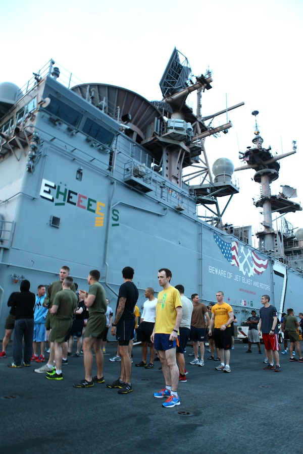 Members of the 24th Marine Expeditionary Unit and Iwo Jima Amphibious Ready Group participate in a 5K Thanksgiving fun run aboard the amphibious assault ship USS Iwo Jima, Nov. 22, 2012. The fun run is part of the Thanksgiving celebration coordinated by the ships Moral, Recreation and Welfare program for the Marines and Sailors. The 24th MEU is deployed with the Iwo Jima ARG and is currently in the 6th Fleet area of responsibility. Since deploying in March, they have supported a variety of missions in the U.S. Central, Africa and European Commands, assisted the Navy in safeguarding sea lanes, and conducted various bilateral and unilateral training events in several countries in the Middle East and Africa. (U.S. Marine Corps photo by Gunnery Sgt. Chad R. Kiehl)