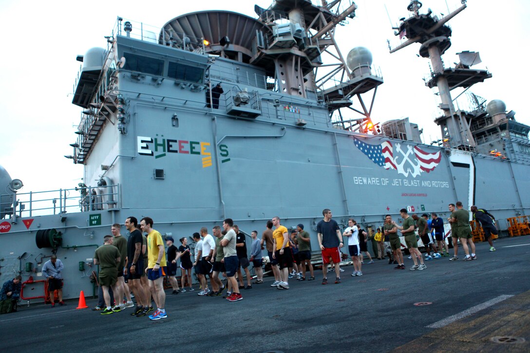 Members of the 24th Marine Expeditionary Unit and Iwo Jima Amphibious Ready Group participate in a 5K Thanksgiving fun run aboard the amphibious assault ship USS Iwo Jima, Nov. 22, 2012. The fun run is part of the Thanksgiving celebration coordinated by the ships Moral, Recreation and Welfare program for the Marines and Sailors. The 24th MEU is deployed with the Iwo Jima ARG and is currently in the 6th Fleet area of responsibility. Since deploying in March, they have supported a variety of missions in the U.S. Central, Africa and European Commands, assisted the Navy in safeguarding sea lanes, and conducted various bilateral and unilateral training events in several countries in the Middle East and Africa. (U.S. Marine Corps photo by Gunnery Sgt. Chad R. Kiehl)