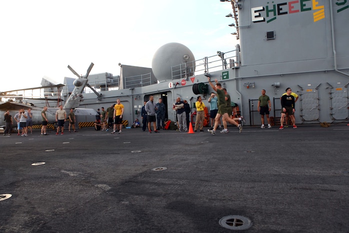Members of the 24th Marine Expeditionary Unit and Iwo Jima Amphibious Ready Group participate in a 5K Thanksgiving fun run aboard the amphibious assault ship USS Iwo Jima, Nov. 22, 2012. The fun run is part of the Thanksgiving celebration coordinated by the ships Moral, Recreation and Welfare program for the Marines and Sailors. The 24th MEU is deployed with the Iwo Jima ARG and is currently in the 6th Fleet area of responsibility. Since deploying in March, they have supported a variety of missions in the U.S. Central, Africa and European Commands, assisted the Navy in safeguarding sea lanes, and conducted various bilateral and unilateral training events in several countries in the Middle East and Africa. (U.S. Marine Corps photo by Gunnery Sgt. Chad R. Kiehl)