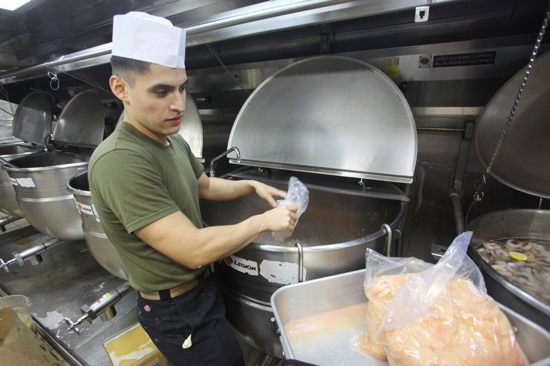 Cpl. Arturo Chavez, a San Jose, Calif., native with the 24th Marine Expeditionary Unit prepares food for the Thanksgiving dinner aboard the amphibious assault ship USS Iwo Jima, Nov. 22, 2012. The 24th MEU is deployed with the Iwo Jima ARG and is currently in the 6th Fleet area of responsibility. Since deploying in March, they have supported a variety of missions in the U.S. Central, Africa and European Commands, assisted the Navy in safeguarding sea lanes, and conducted various bilateral and unilateral training events in several countries in the Middle East and Africa. (U.S. Marine Corps photo by Lance Cpl. Tucker S. Wolf/Released)