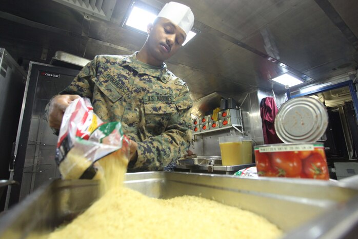 USS IWO JIMA, Mediterranean Sea (Nov. 22, 2012) -  Lance Cpl. Elvis Fernandez, a Lisboa, Portugal, native with the 24th Marine Expeditionary Unit prepares food for the Thanksgiving dinner aboard the amphibious assault ship USS Iwo Jima, Nov. 22, 2012. The 24th MEU is deployed with the Iwo Jima ARG and is currently in the 6th Fleet area of responsibility. Since deploying in March, they have supported a variety of missions in the U.S. Central, Africa and European Commands, assisted the Navy in safeguarding sea lanes, and conducted various bilateral and unilateral training events in several countries in the Middle East and Africa. (U.S. Marine Corps photo by Lance Cpl. Tucker S. Wolf/Released)