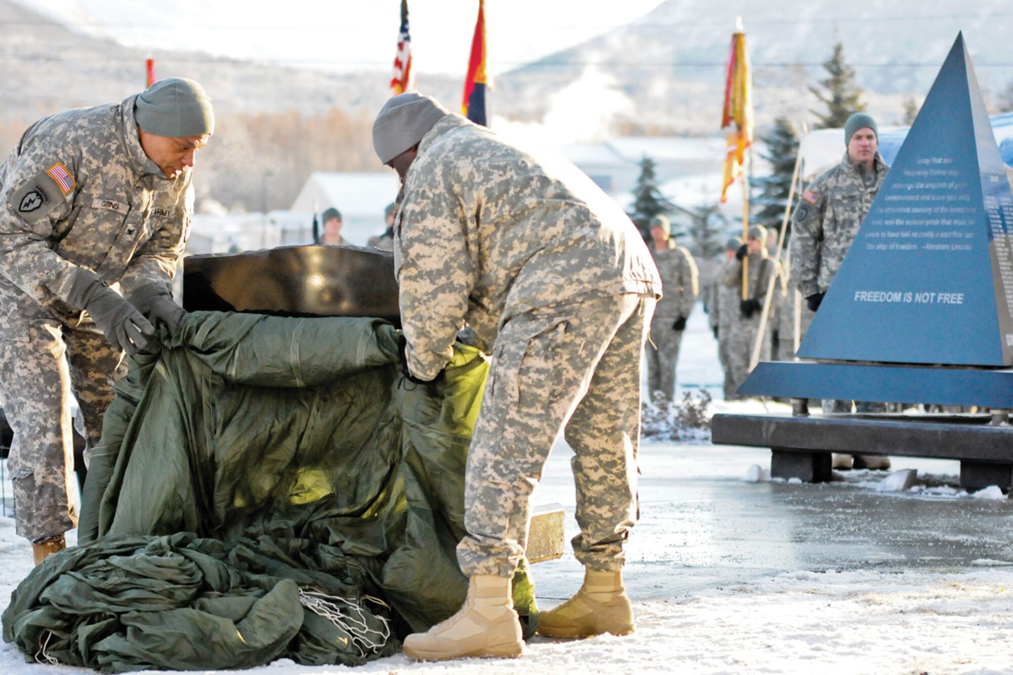 Army Col. Morris Goins, commander of the 4th Brigade Combat Team (Airborne), 25th Infantry Division, and Command Sgt. Maj. Terry Gardner, 4-25th ABCT command sergeant major, unveiled the brigade’s memorial monument at JBER, Nov. 16. The ceremony was hosted to honor the Brigade’s fallen paratroopers. (U.S. Army photo/Sgt. 1st Class Jason Epperson)
