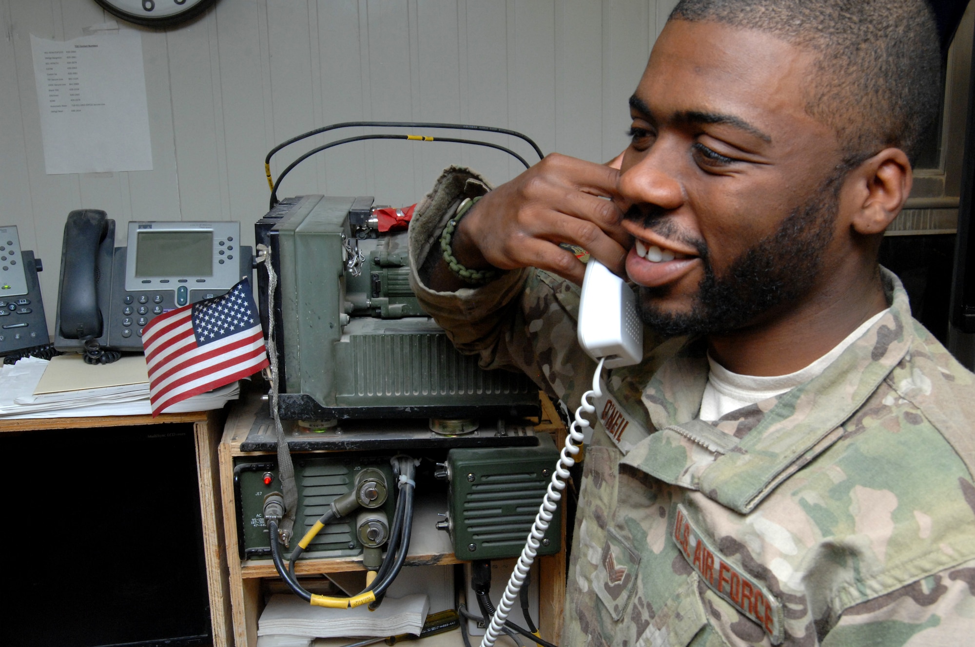 U.S. Air Force Senior Airman Khalid O'Neil, 451st Expeditionary Security Forces Squadron, receives a Thanksgiving-day phone call from President Barack Obama Nov. 22. The Commander-in-Chief thanked O'Neil for his service and asked him about his experiences while deployed to KAF. O’Neil, from Trenton, N.J., is a St. Louis Rams fan and also talked about football with the president. "That was a pretty cool experience," O'Neil said. "He sounded just like he did on TV. It's not something I will forget, that's for sure." (U.S. Air Force photo/Master Sgt. Russell Martin)