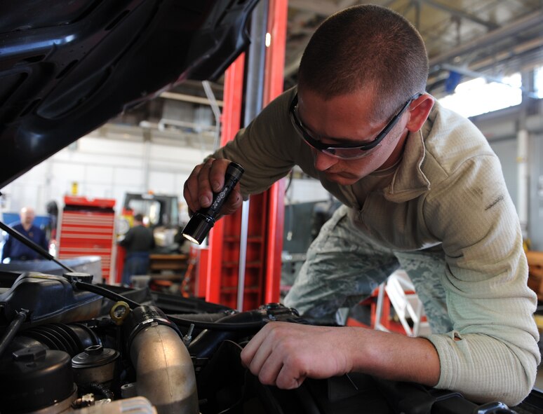 WHITEMAN AIR FORCE BASE, Mo. -- Senior Airman Eduardo Swizer, 509th Logistics Readiness Squadron vehicle mechanic, troubleshoots a wiring harness during a vehicle inspection, Nov. 2. The vehicle maintenance shop performs major maintenance to include transmissions overhauls, engines overhauls and power trains overhauls. (U.S. Air Force photo/Airman 1st Class Bryan Crane) (Released)