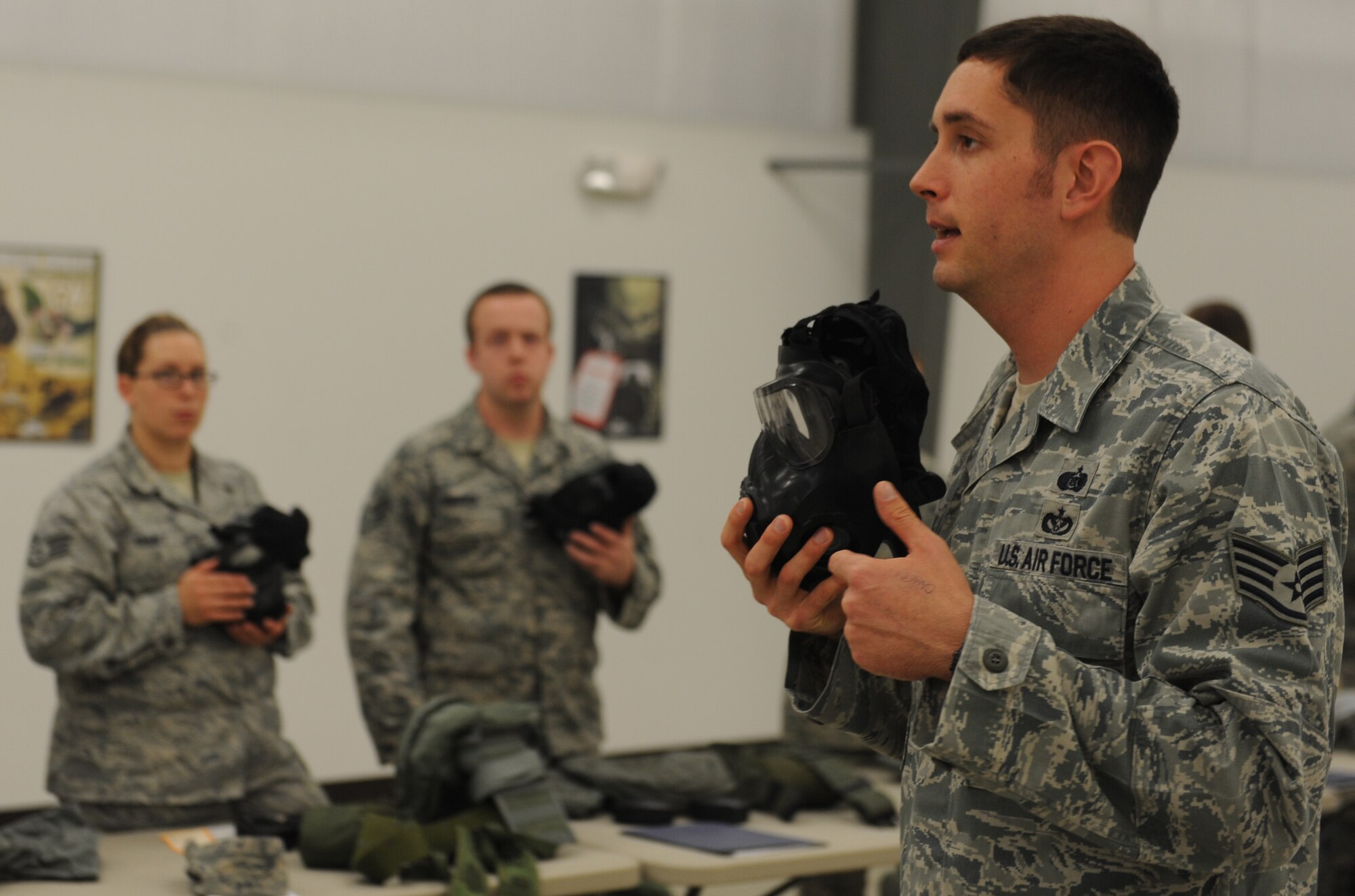 WHITEMAN AIR FORCE BASE, Mo. -- Staff Sgt. Jim Blackwell, 509th Civil Engineer Chemical, Biological, Radiological and Nuclear instructor, teaches the class proper techniques on taking care of their M-50 chemical mask. CBRN classes are conducted to ensure all base personnel are prepared in case of an actual chemical attack. (U.S. Air Force photo/Airman 1st Class Bryan Crane) (Released)