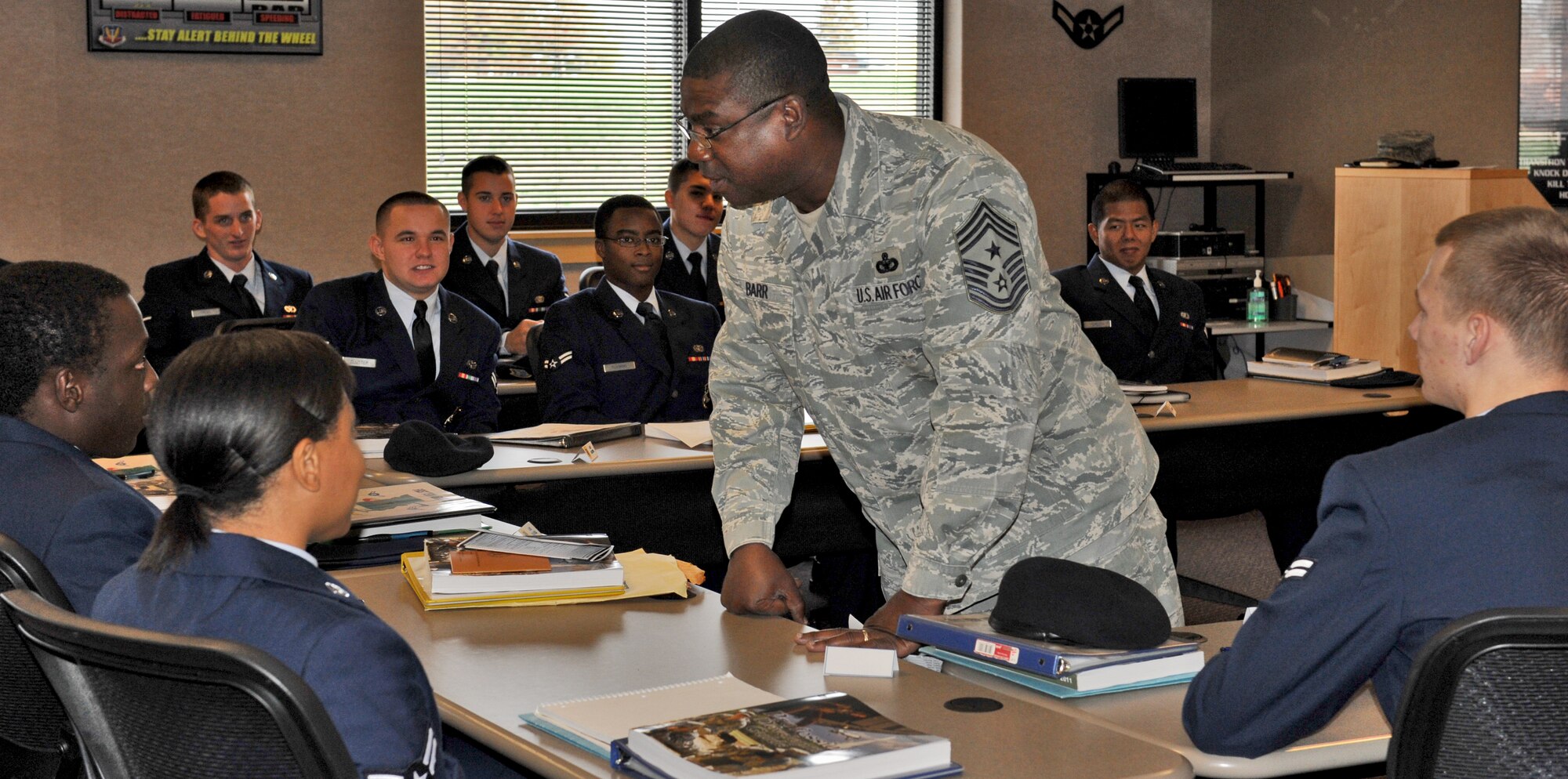 Chief Master Sgt. Lee Barr, 509th Bomb Wing command chief, speaks to First Term Airmen Center students Oct. 29 at Whiteman Air Force Base, Mo. FTAC holds a five-day class every Monday to help first-term Airmen get all the information they need about the base and the services it has to offer. (U.S. Air Force photo/Heidi Hunt)