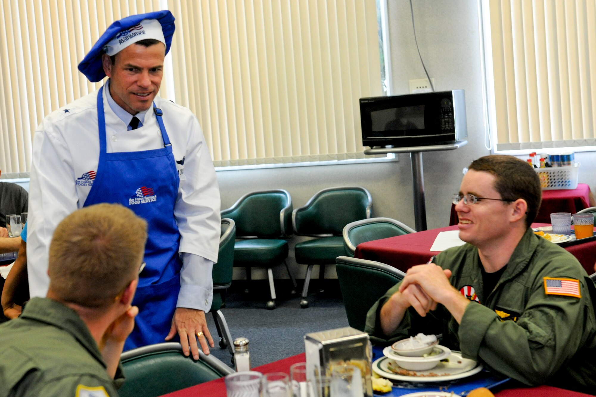 U.S. Air Force Brig. Gen. Matt Molloy, 18th Wing commander, speaks with Airmen at the Marshall Dining Facility during Thanksgiving on Kadena Air Base, Japan, Nov. 22, 2012. Kadena's leadership served various Thanksgiving dishes to more than 100 Airmen during the holiday. (U.S. Air Force photo/Airman 1st Class Hailey R. Davis) 