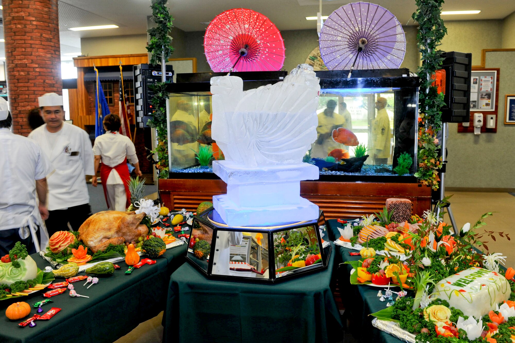 An ice centerpiece surrounded by food sits at the entrance of the Marshall Dining Facility during the Thanksgiving meal for Airmen on Kadena Air Base, Japan, Nov. 22, 2012. Kadena's leadership served various Thanksgiving dishes to more than 100 Airmen during the holiday. (U.S. Air Force photo/Airman 1st Class Hailey R. Davis) 