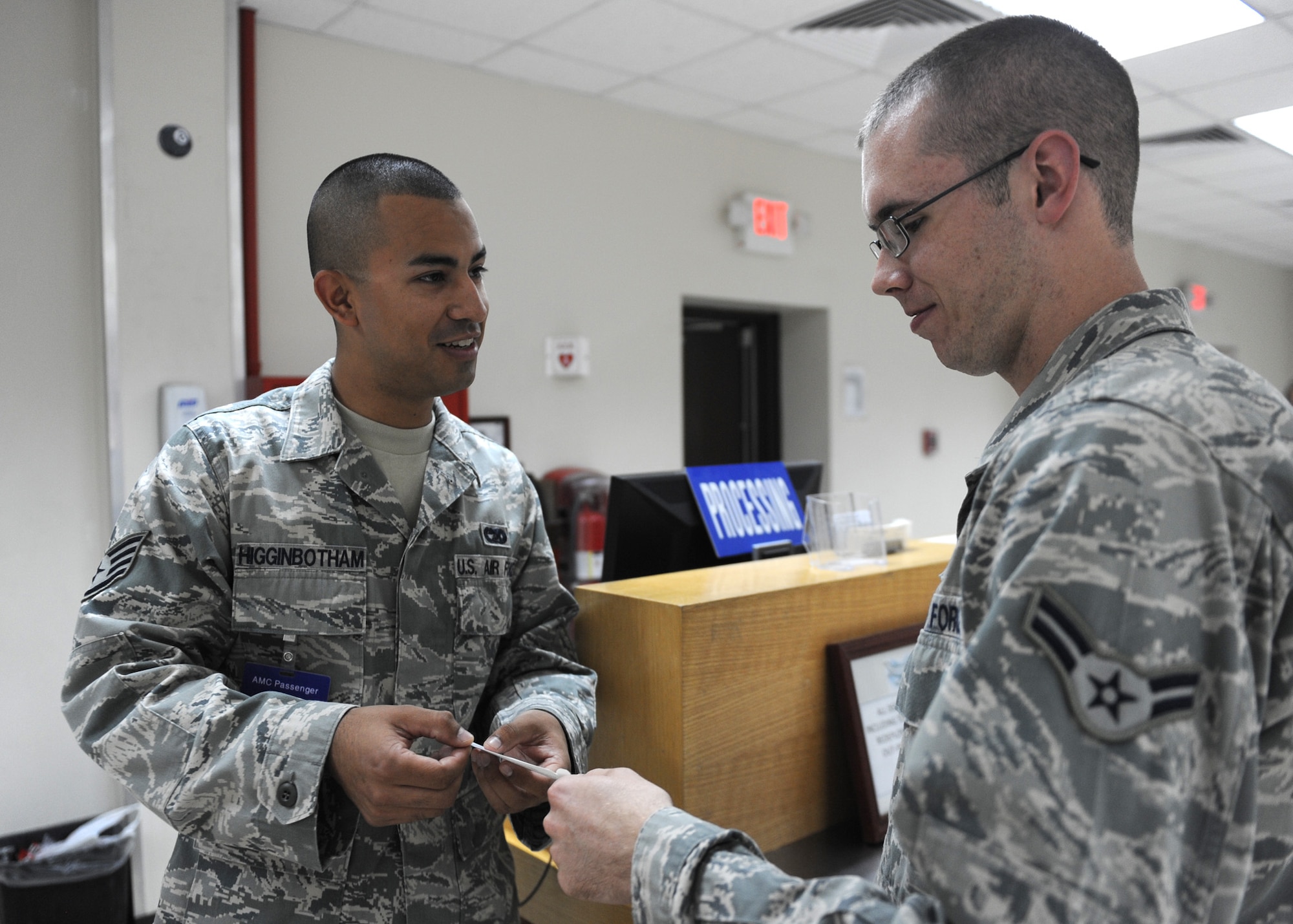 SOUTHWEST ASIA - Staff Sgt. Robert Higginbotham, 8th Expeditionary Air Mobility Squadron, takes care of a customer at the Air Mobility Command Terminal Nov. 21, 2012. Higginbotham was recognized during the Multi-Major Command Staff Assistance Visit for his lost and found baggage program, which recovered more than 980 lost pieces of luggage to the warfighter and saved AMC more than $197,000 at the largest strategic aerial port in the area of responsibility. Higginbotham, a native of Magnolia, Texas, is deployed from the 721st Aerial Port Squadron at Ramstein Air Base, Germany. (U.S. Air Force photo/Senior Airman Joel Mease)