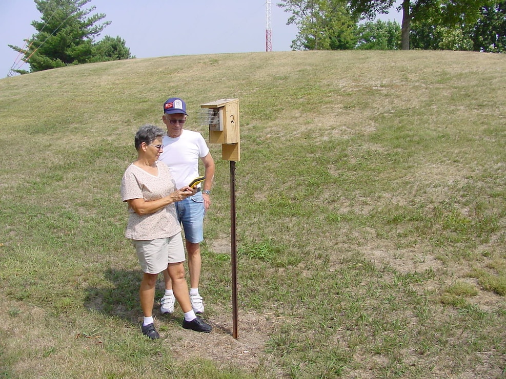 Volunteers checking bluebird nest box