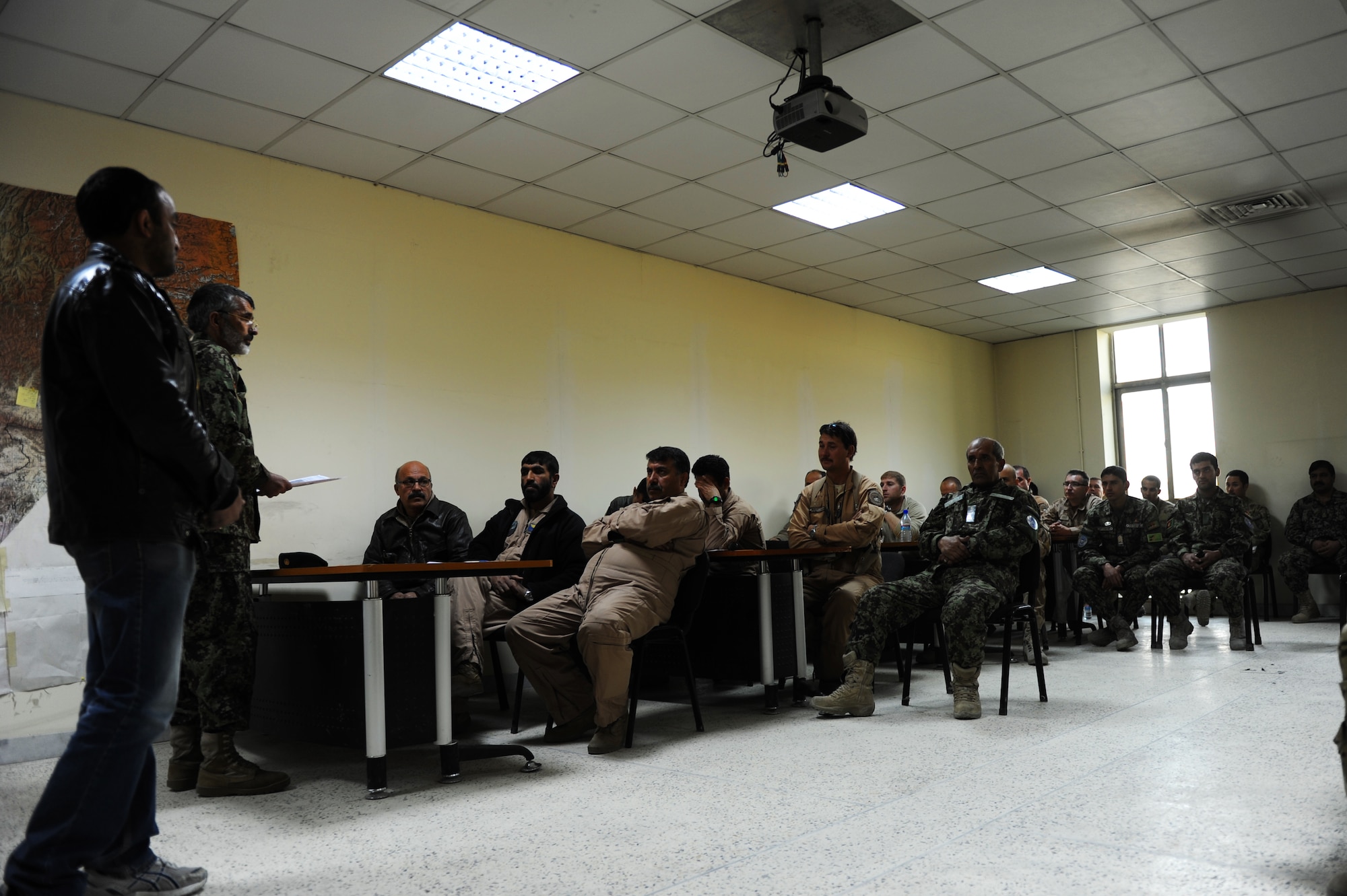 Afghan Air Force Maj. Hamidullah, Kabul Air Wing weather section commander, gives the morning weather briefing to Afghan Air Force, Coalition and U.S. Air Force aircrew Nov. 15, 2012 at Kabul, Afghanistan, International Airport. The Kabul wing weather office produces a mission-execution forecast which enables the flying squadrons to take advantage of weather information and accomplish their missions. (U.S. Air Force photo/Staff Sgt. Melissa K. Mekpongsatorn)