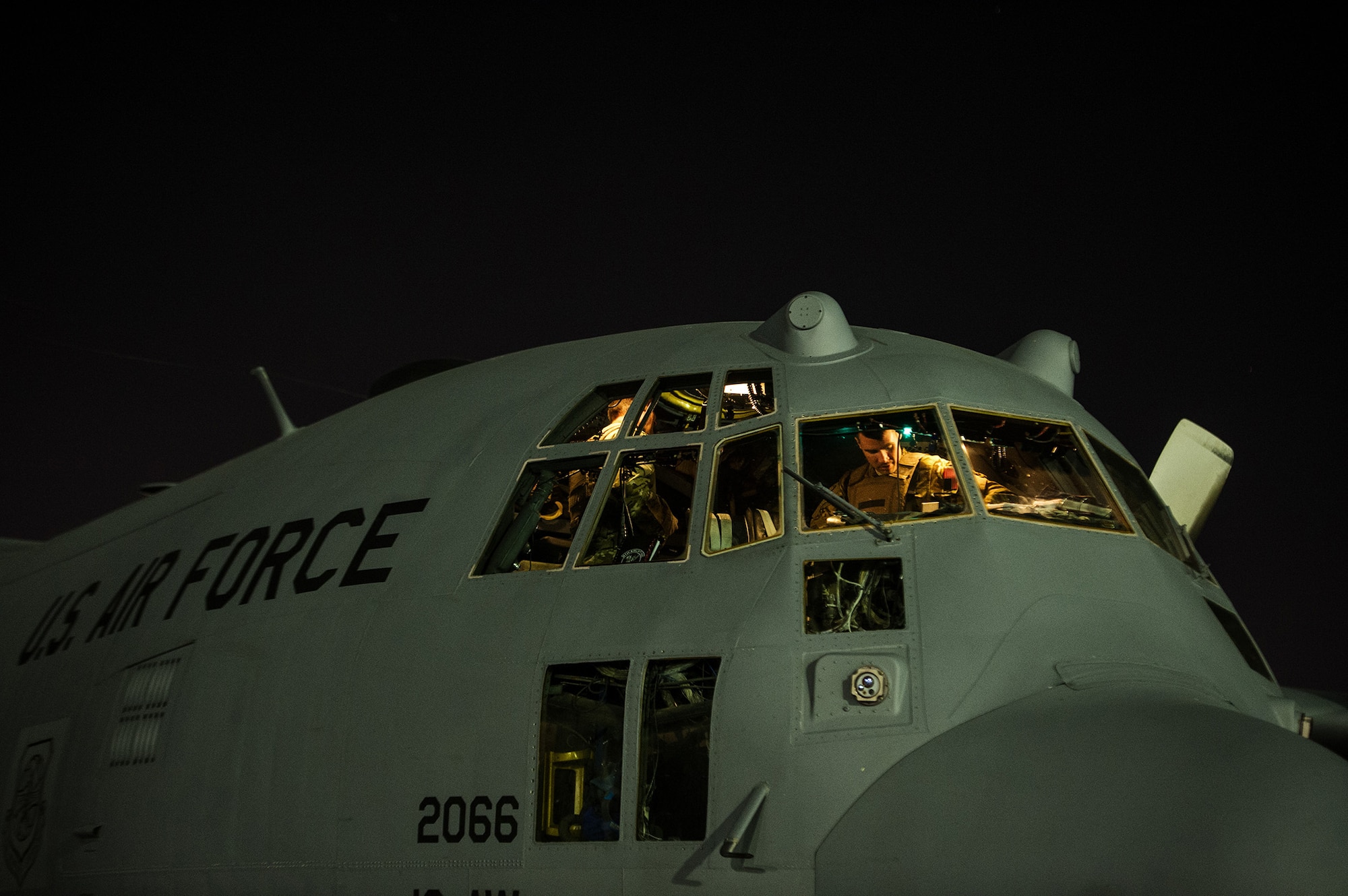 U.S. Air Force Maj. Jake Hiles, 774th Expeditionary Airlift Squadron, pilot, prepares for the day's mission on a U.S. Air Force C-130H Hercules Nov. 3, 2012, at Bagram Airfield, Afghanistan. The 774th EAS provides tactical airlift, airdrop and aeromedical evacuation, creating an air bridge for personnel, equipment and supplies. Hiles' hometown is Shelocta, Pa. (U.S. Air Force photo/Staff Sgt. Jonathan Snyder)
