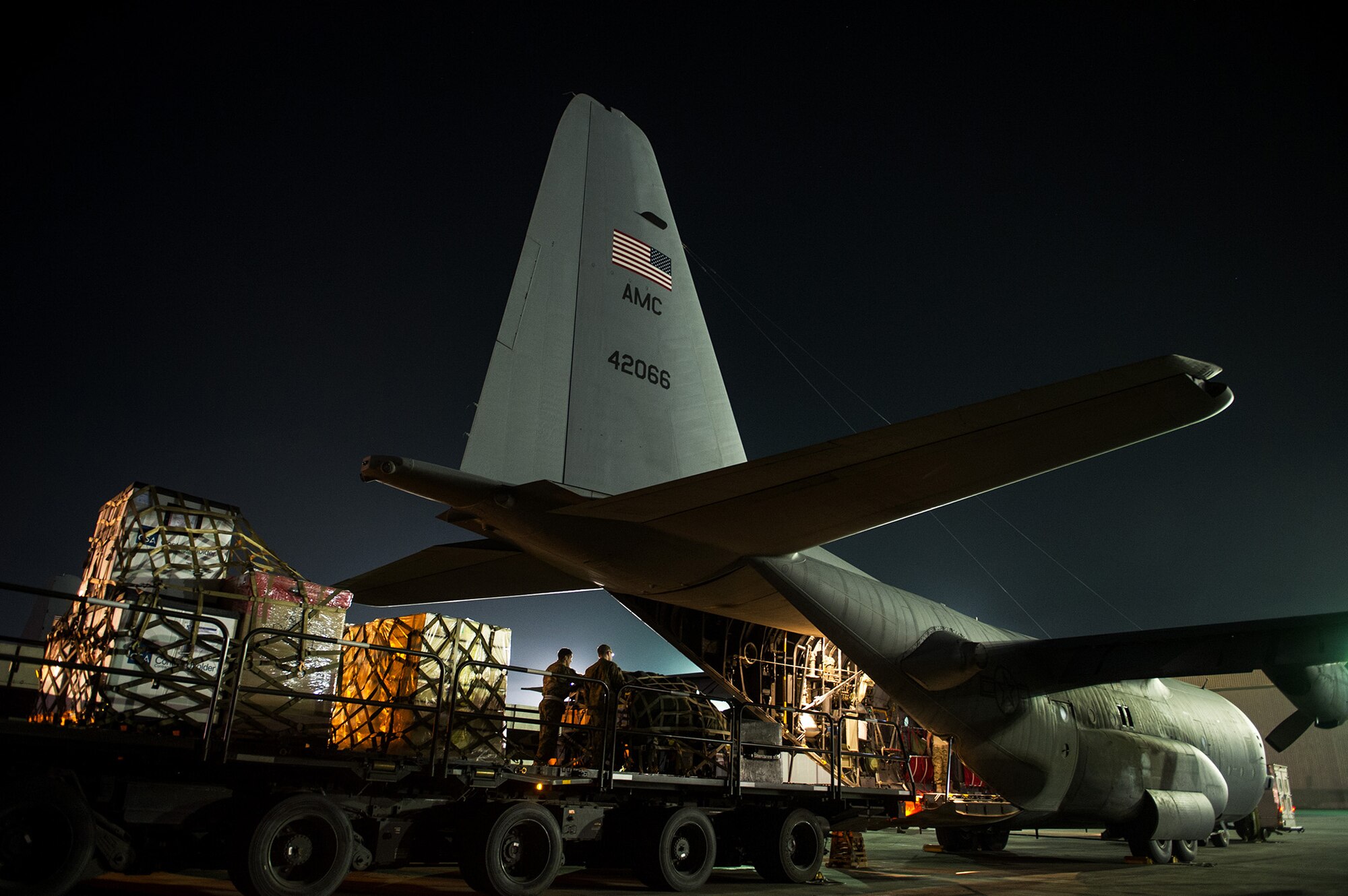 U.S. Air Force Airmen from the 774th Expeditionary Airlift Squadron load pallets on a U.S. Air Force C-130H Hercules Nov. 3, 2012, at Bagram Airfield, Afghanistan. The 774th EAS provides tactical airlift, airdrop and aeromedical evacuation, creating an air bridge for personnel, equipment and supplies. (U.S. Air Force photo/Staff Sgt. Jonathan Snyder)