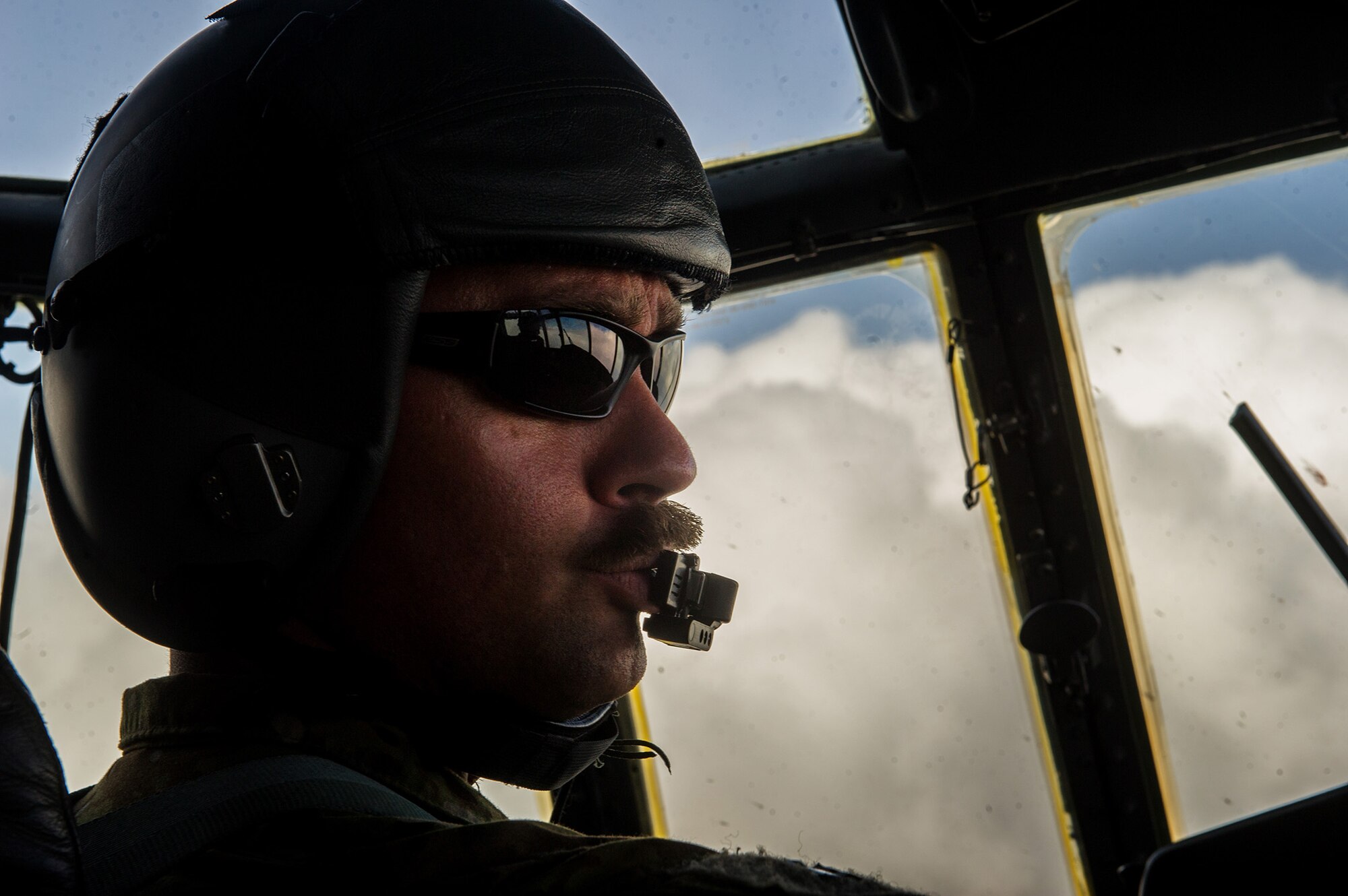 U.S. Air Force Maj. Matthew Eckles, 774th Expeditionary Airlift Squadron pilot, talks with aircrew on a U.S. Air Force C-130H Hercules Oct. 31, 2012, Bagram Airfield, Afghanistan. The 774th EAS provides tactical airlift, airdrop and aeromedical evacuation, creating an air bridge for personnel, equipment and supplies. Eckles' hometown is Norman, Okla. (U.S. Air Force photo/Staff Sgt. Jonathan Snyder)