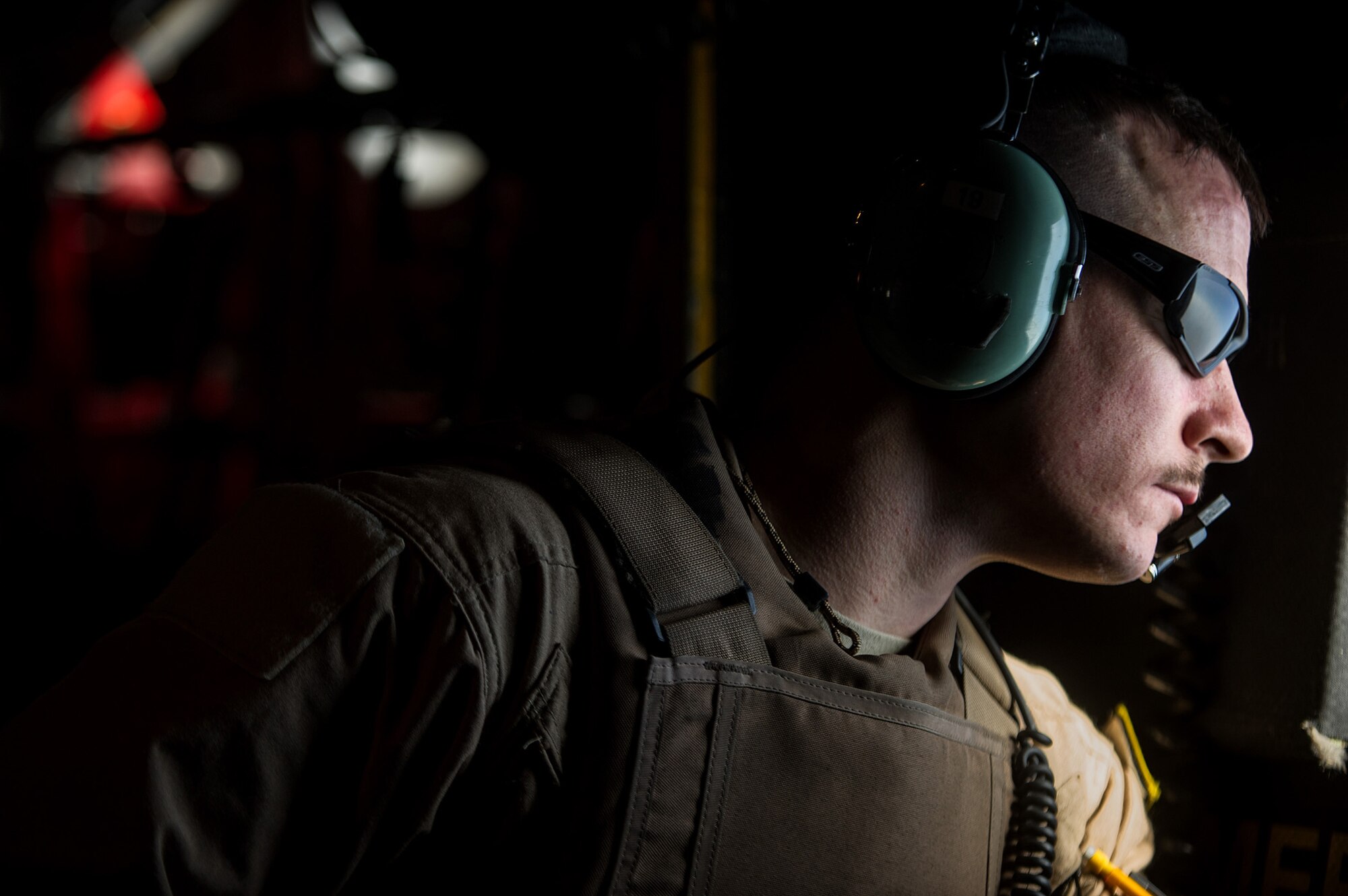 U.S. Air Force Airman 1st Class Luke Tucciarone, 774th Expeditionary Airlift Squadron loadmaster, scans outside of a U.S. Air Force C-130H Hercules for threats on the ground Oct. 31, 2012, over Afghanistan. The 774th EAS provides tactical airlift, airdrop and aeromedical evacuation, creating an air bridge for personnel, equipment and supplies. Tucciarone's hometown is Oxford, Conn. (U.S. Air Force photo/Staff Sgt. Jonathan Snyder)