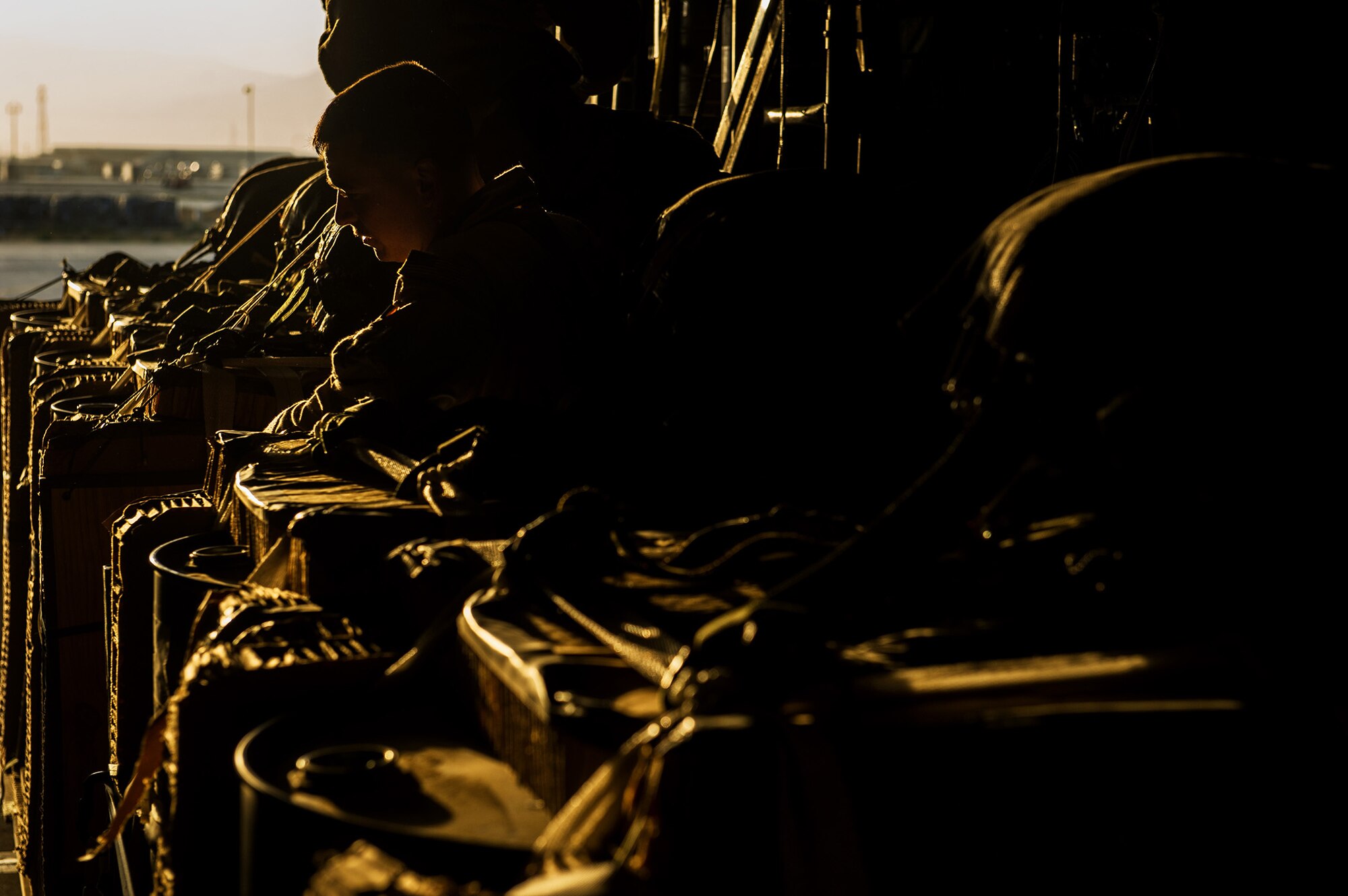 U.S. Air Force Airman 1st Class Luke Tucciarone, 774th Expeditionary Airlift Squadron loadmaster, checks the pallets on a U.S. Air Force C-130H Hercules Oct. 31, 2012, Bagram Airfield, Afghanistan. The 774th EAS provides tactical airlift, airdrop and aeromedical evacuation, creating an air bridge for personnel, equipment and supplies. Tucciarone's hometown is Oxford, Conn. (U.S. Air Force photo/Staff Sgt. Jonathan Snyder)