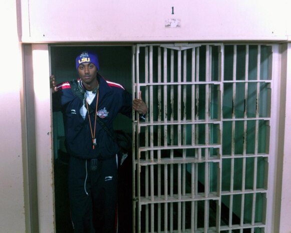 Seaman Sean M. Vincent, a corpsman with 2nd Dental Battalion, 2nd Marine Logistics Group, poses in a prison cell during a trip to Alcatraz Island, Calif., Sept. 22, 2012. Vincent participated in the Red Bull King of the Rock 2012 basketball tournament on Alcatraz.