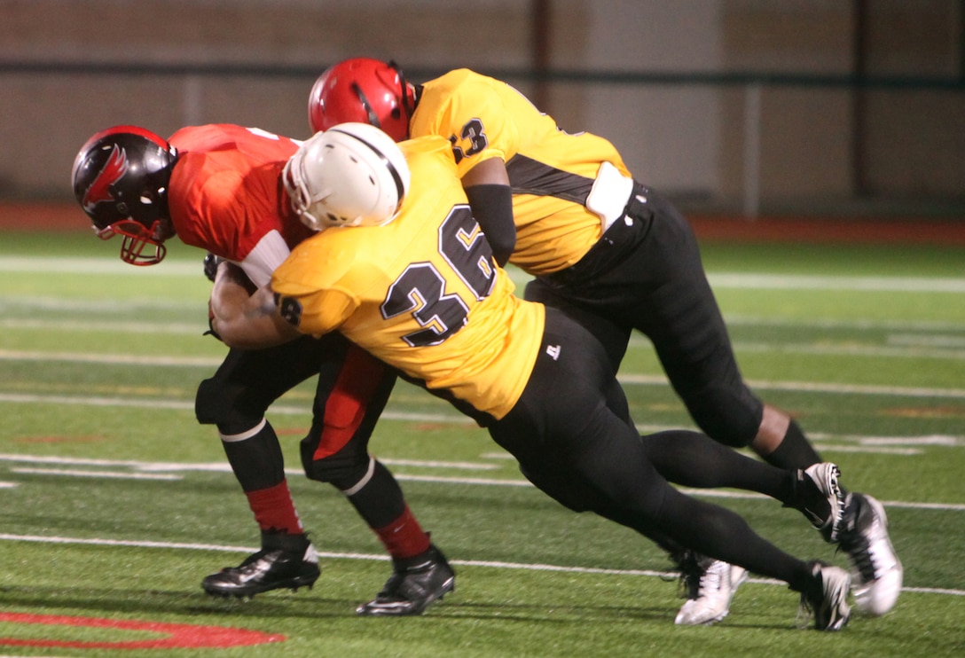 After an amazing season of continuous wins, Marines and sailors with the 1st Marine Logistics Group football team the Beast made it to the Camp Pendleton Cup here Nov. 20. Playing against the Marine Corps Air Station Miramar Falcons, the Beast went on to win the championship 14-6. 