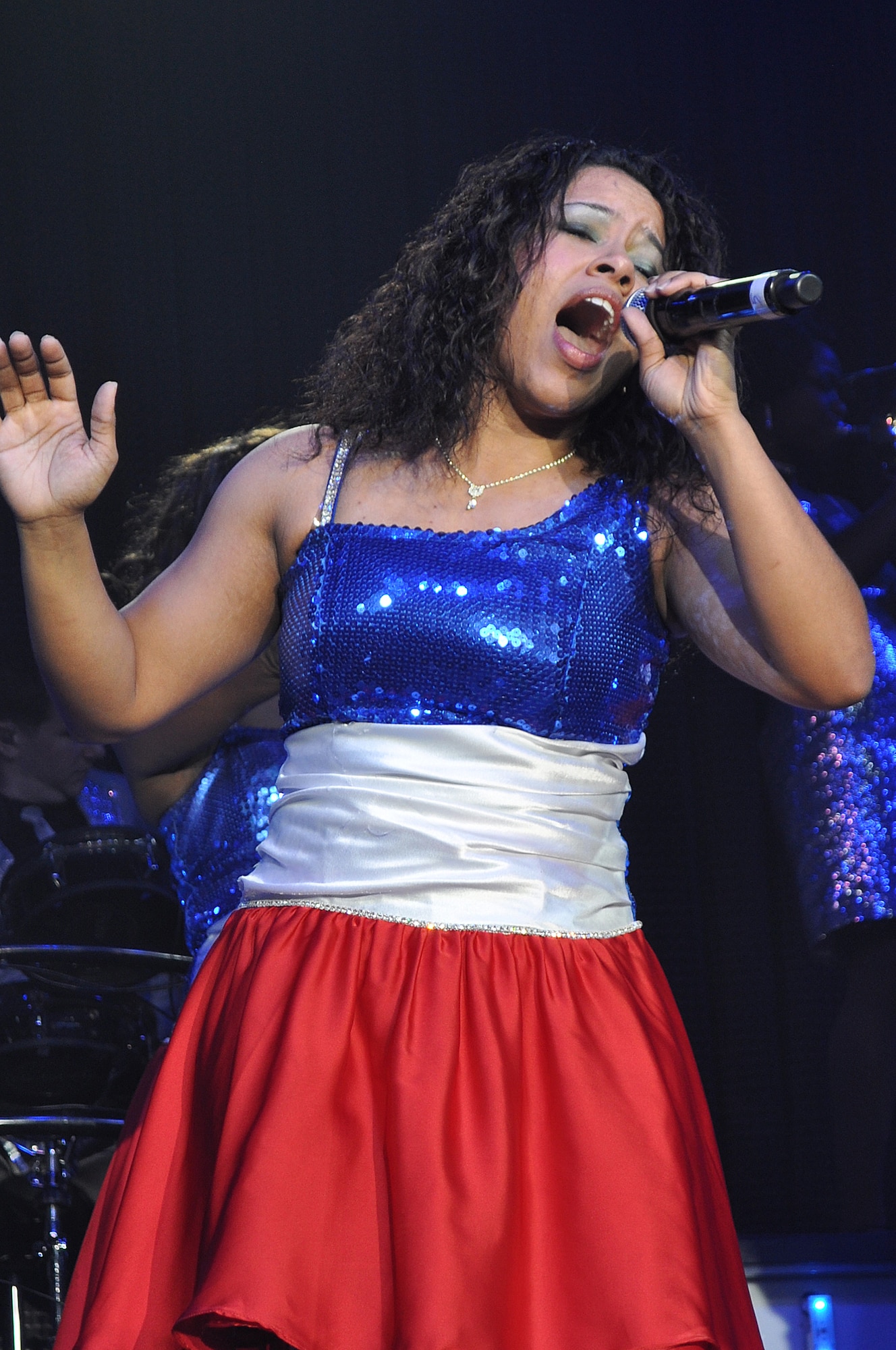 Senior Airman Joanell Jacques, 15th Air Support Operations Squadron RF transmission journeyman from Fort Stewart, La.; hits a high note for the Osan Air Base community during the performance of their Tops in Blue show “Listen.” The team performed for a packed house at the base theater Nov. 24, 2012. (U.S. Air Force photo/Senior Airman Kristina Overton) 