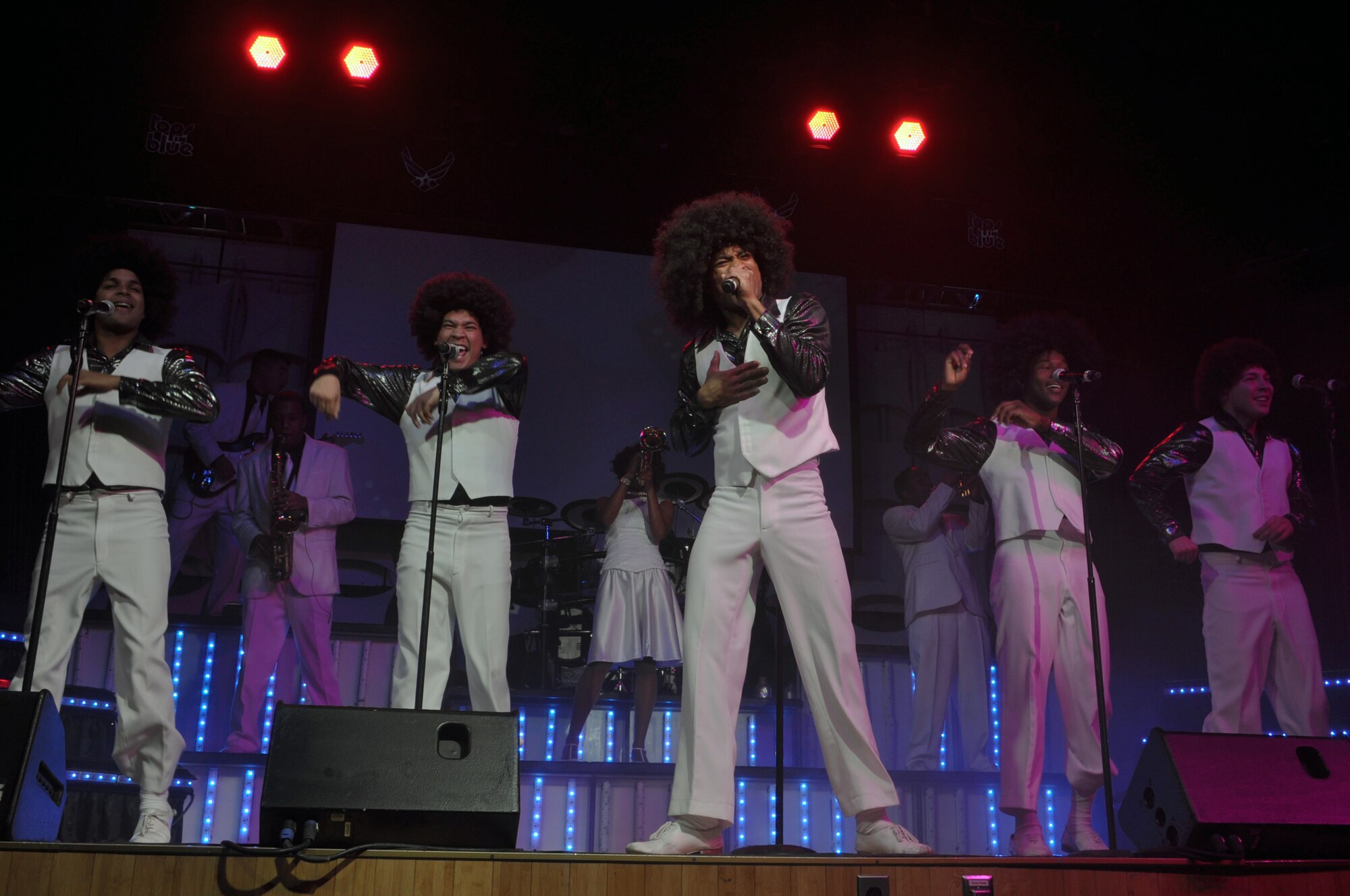 Senior Airman Charles Cooper, 86th Vehicle Readiness Squadron vehicle operator journeyman; Ramstein Air Base, Germany; sings the lead for the Jackson 5 medley with the other Tops in Blue male vocalists during their show Nov.24, 2012. The Michael Jackson set featured hits such as “Man in the Mirror,” “Beat It,” and “Smooth Criminal.” (U.S. Air Force photo/Senior Airman Kristina Overton)