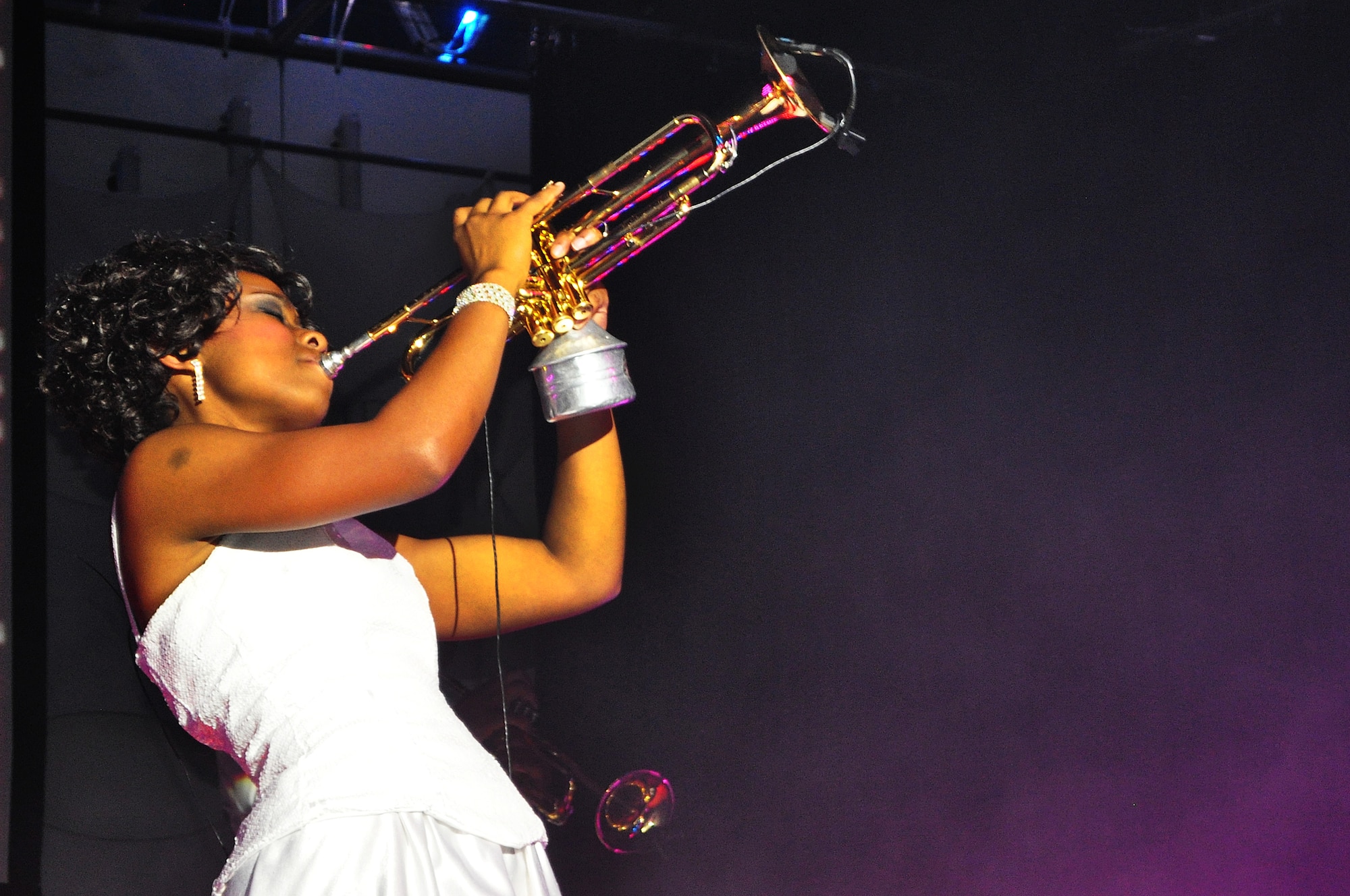 Airman 1st Class Jessica Pitts, 606th Air Control Squadron cyber systems operations apprentice; Spangdahlem Air Base, Germany; plays a trumpet solo for “Human Nature” by Michael Jackson Nov.24, 2012.  Pitts is one of 31 performers and technical staff members traveling with the Tops in Blue tour this year. (U.S. Air Force photo/Senior Airman Kristina Overton)