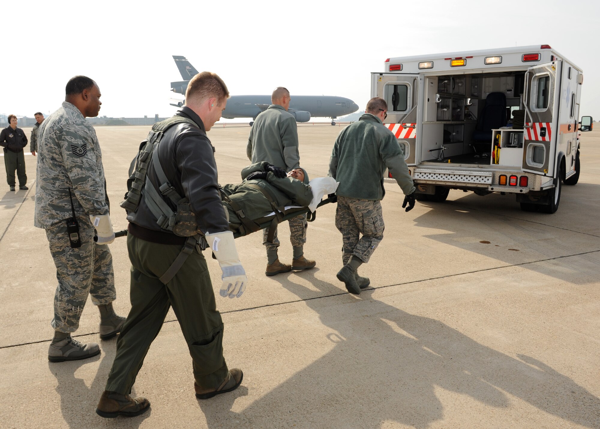 Members of the 8th Medical Group carry Maj. Franklin Waddell, 8th Medical Operations Squadron, to an ambulance during a training exercise on Kunsan Air Base, Republic of Korea, Nov. 21, 2012. The exercise included participants from the US Air Force, US Army, US Navy and ROK Navy. (U.S. Air Force photo/Staff Sgt. Jonathan Fowler)