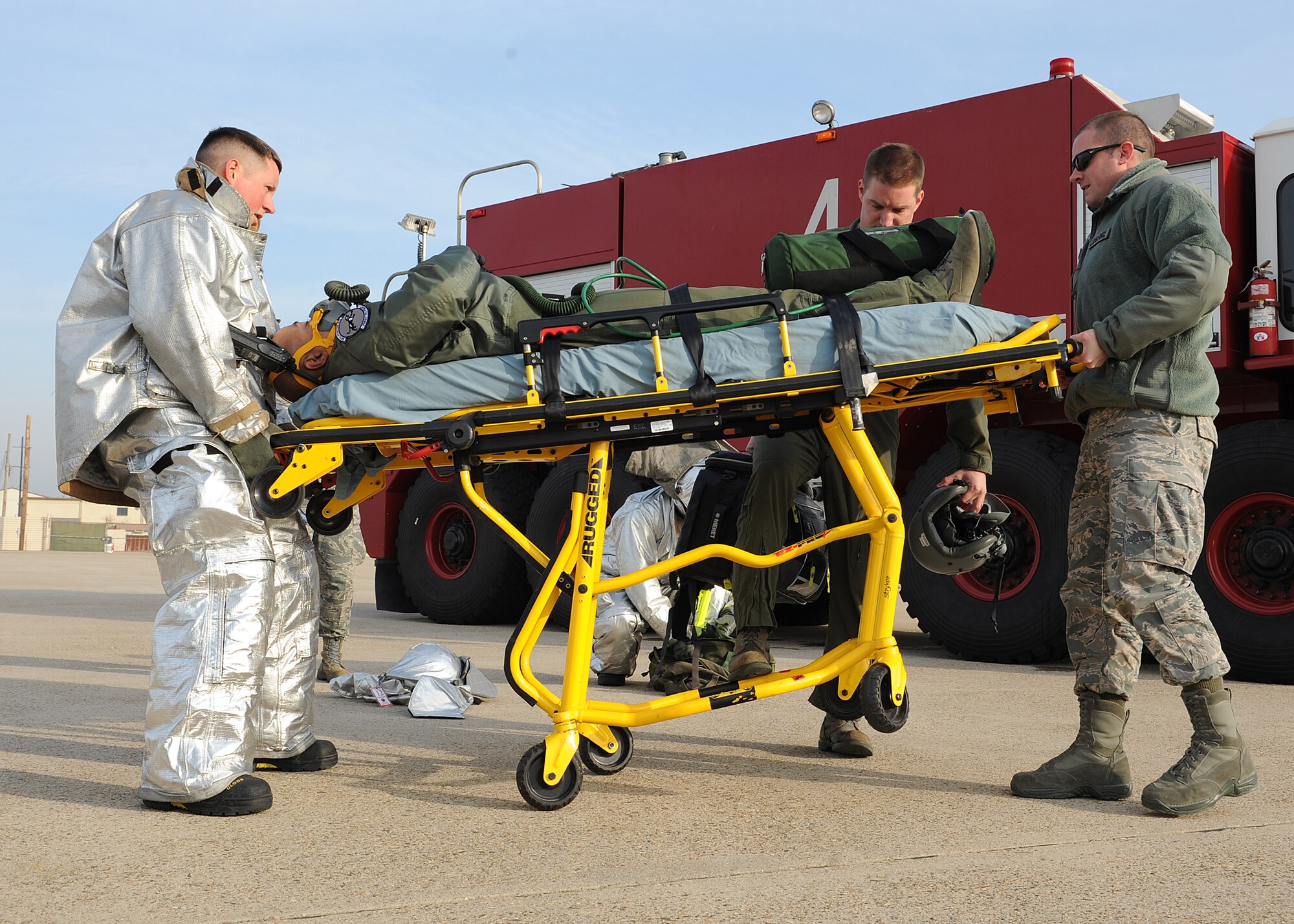 Staff Sgt. Jared Lott, 8th Civil Engineer Squadron, and Senior Airman Christopher Keeton, 8th Medical Operations Squadron, secure the wheels of a gurney during a training exercise on Kunsan Air Base, Republic of Korea, Nov. 21, 2012. This was part of a medical evacuation exercise that involved personnel from Kunsan AB, Camp Humphreys and Chinhae ROK Naval Base. (U.S. Air Force photo/Staff Sgt. Jonathan Fowler)