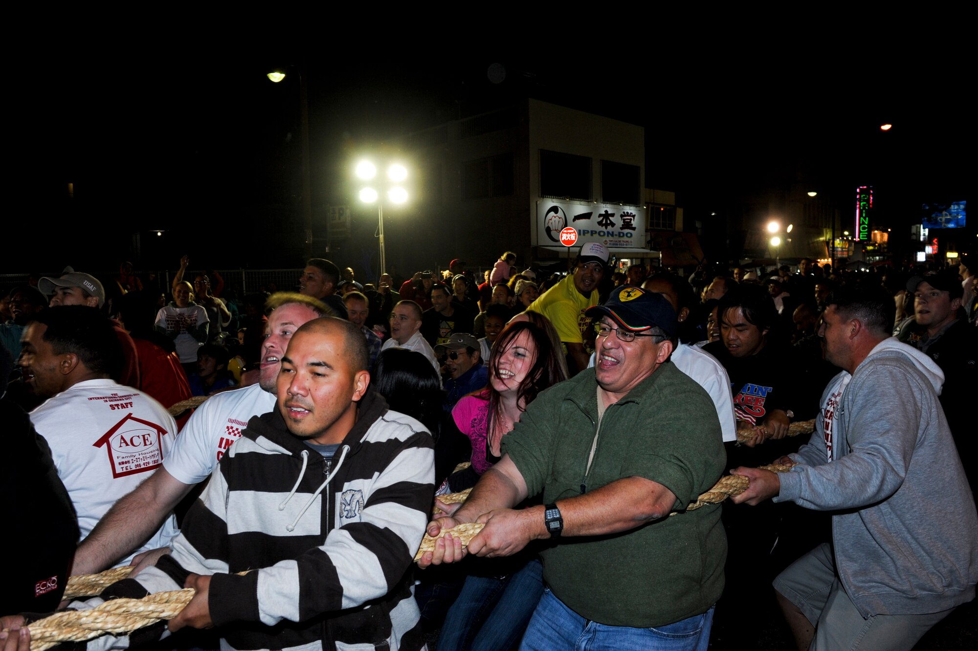 Airmen Committed to Excellence and other volunteers pull the rope to win the tug-of-war competition during the International Carnival in Okinawa, Japan, Nov. 24, 2012. Approximately 900 Okinawan and American residents also participated in an International Parade - including more than 100 volunteers from Kadena High School's marching band, Ballet Folklorico Mexicano de Okinawa, Order of Eastern Star, and representatives from the U.S. military bases across Okinawa. (U.S. Air Force photo/Airman 1st Class Justin Veazie)