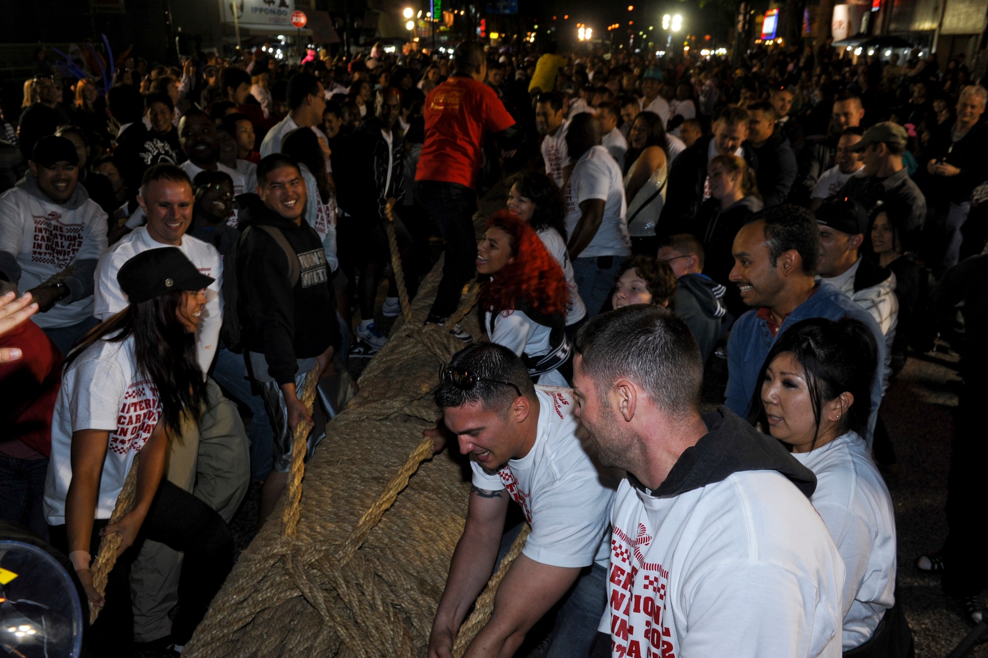 Participants prepare to pull on the rope during the tug-of-war at the end of the International Carnival in Okinawa City, Japan, Nov. 24, 2012. Approximately 6,000 Okinawans and Americans were involved in the international tug of war. (U.S. Air Force photo/Airman 1st Class Justin Veazie)