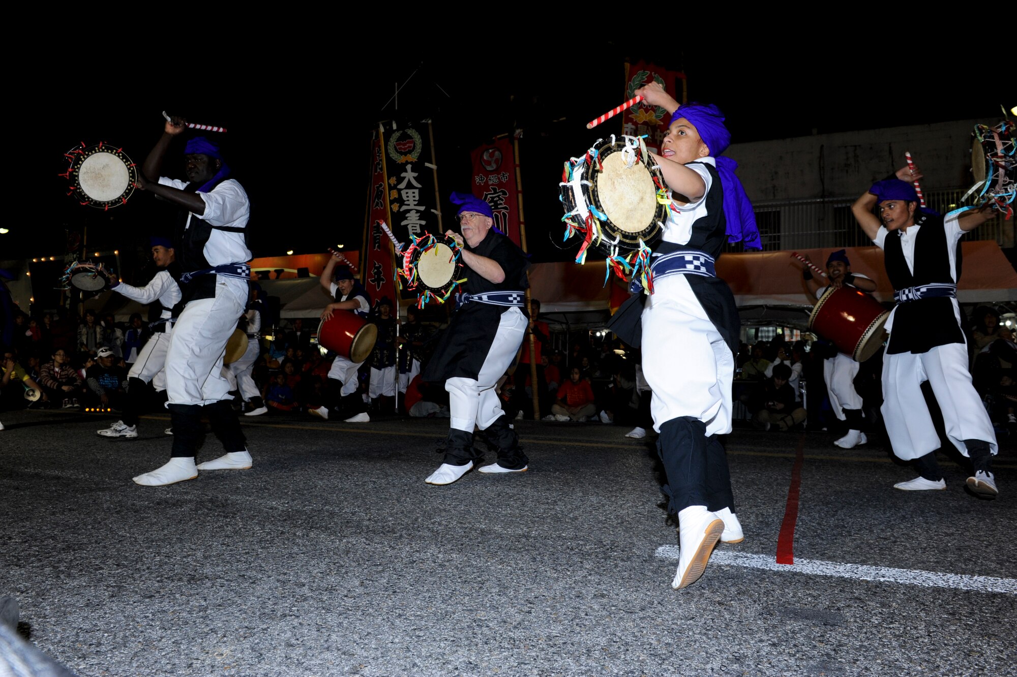 Eisa dancers perform at the International Carnival in Okinawa, Japan, Nov. 24, 2012.Eisa is a dance where 20-30 young men and/or women dance, mainly in a circle to the accompaniment of singing, chanting and drumming by other dancers. Folk songs are also played on the sanshin. (U.S. Air Force photo/Airman 1st Class Justin Veazie)