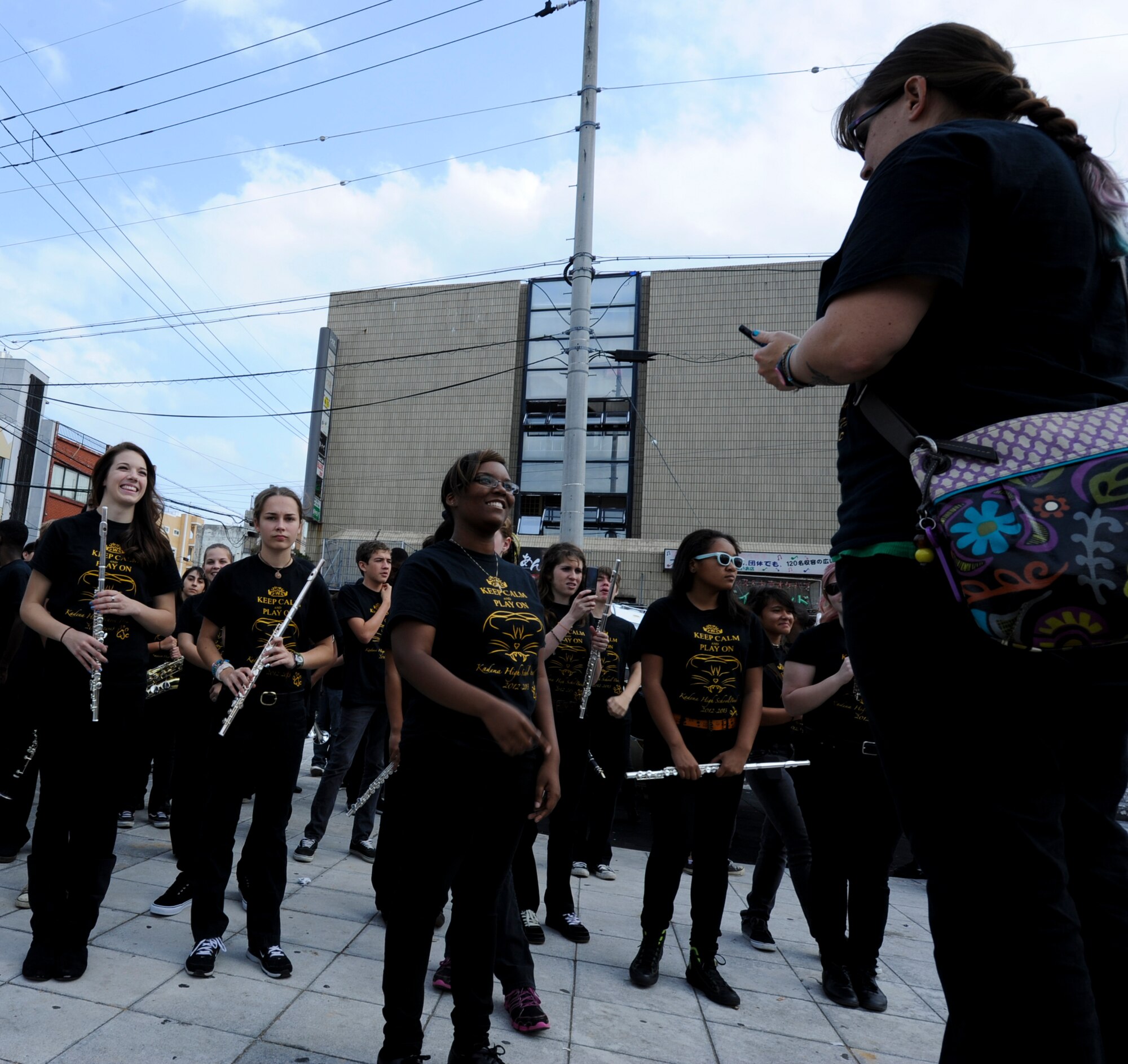 The Kadena High School marching band prepares to perform during the International Carnival in Okinawa, Japan, Nov. 24, 2012. This is the 21st carnival that aimed to include various activities with the base and local community. It also promotes international friendships in diverse cultures through a variety of music, sports and stage events. (U.S. Air Force photo/Airman 1st Class Justin Veazie)