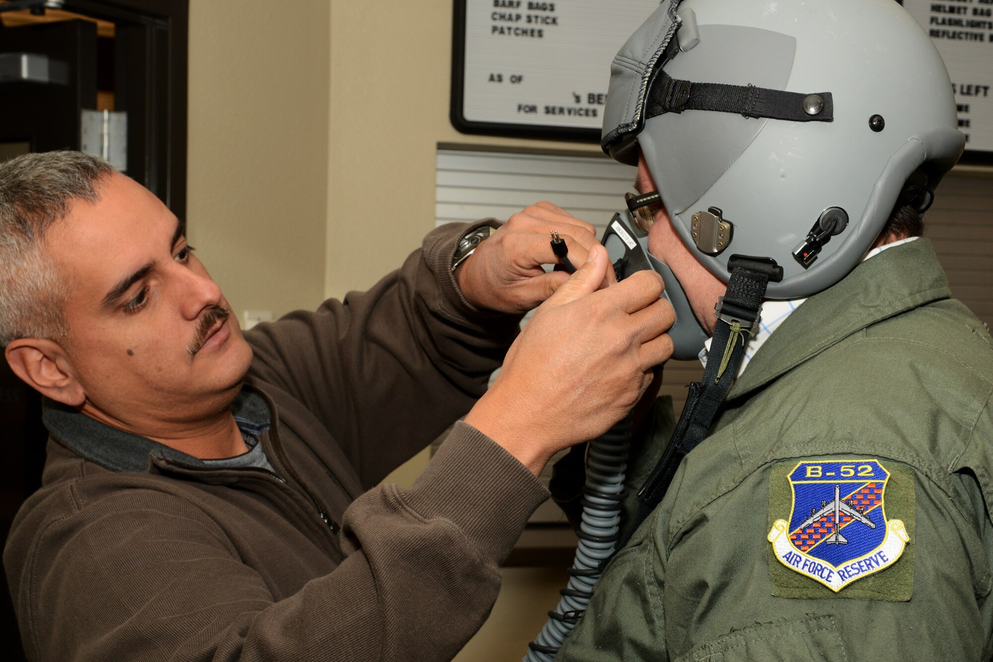 Bradley Schoth, 307th Operations Support Flight aircrew flight equipment supervisor, fits Dr. Alexandr Vondra, Minister of Defense of the Czech Republic, with a helmet and oxygen mask, Nov. 21, 2012, Barksdale Air Force Base, La. During Vondra’s visit to Barksdale, he was treated to an incentive flight on a 93rd Bomb Squadron B-52H Stratofortress. (U.S. Air Force photo by Master Sgt. Greg Steele/Released)