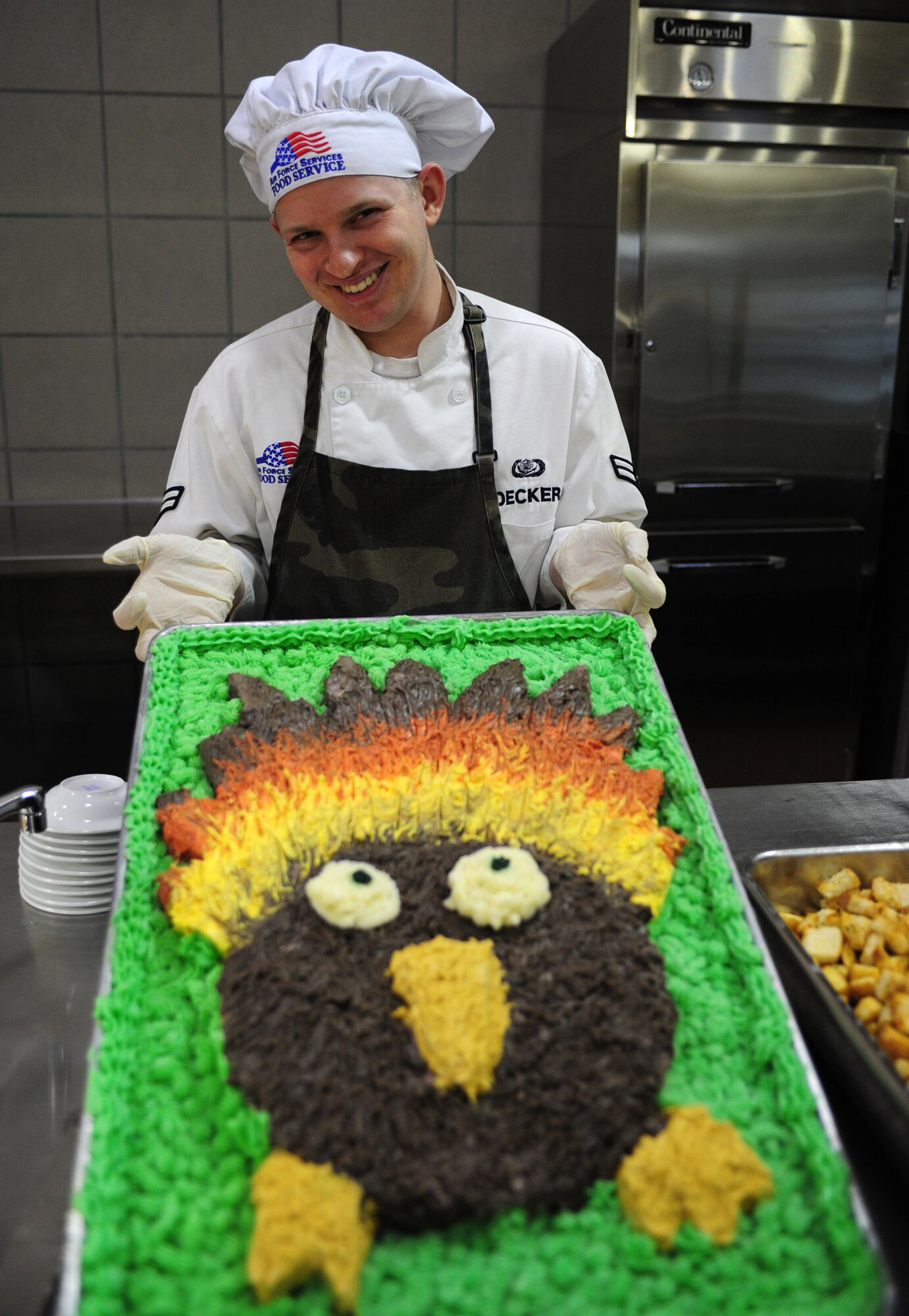 U.S. Air Force Airman 1st Class Andrew Decker, 27th Special Operation Force Support Squadron, holds a turkey cake that was created for the Thanksgiving meal at the Pecos Trail Dining Facility at Cannon Air Force Base, N.M., Nov. 22, 2012. The dining facility staff went to great lengths to provide a filling and heartwarming experience for the Airmen who were unable to be with their families during the holiday. (U.S. Air Force photo/Airman 1st Class Ericka Engblom)