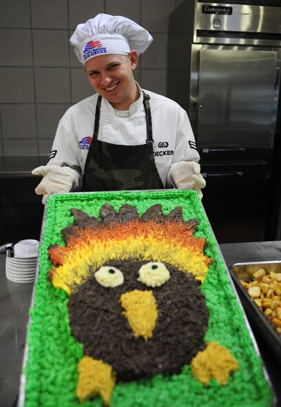 U.S. Air Force Airman 1st Class Andrew Decker, 27th Special Operation Force Support Squadron, holds a turkey cake that was created for the Thanksgiving meal at the Pecos Trail Dining Facility at Cannon Air Force Base, N.M., Nov. 22, 2012. The dining facility staff went to great lengths to provide a filling and heartwarming experience for the Airmen who were unable to be with their families during the holiday. (U.S. Air Force photo/Airman 1st Class Ericka Engblom)