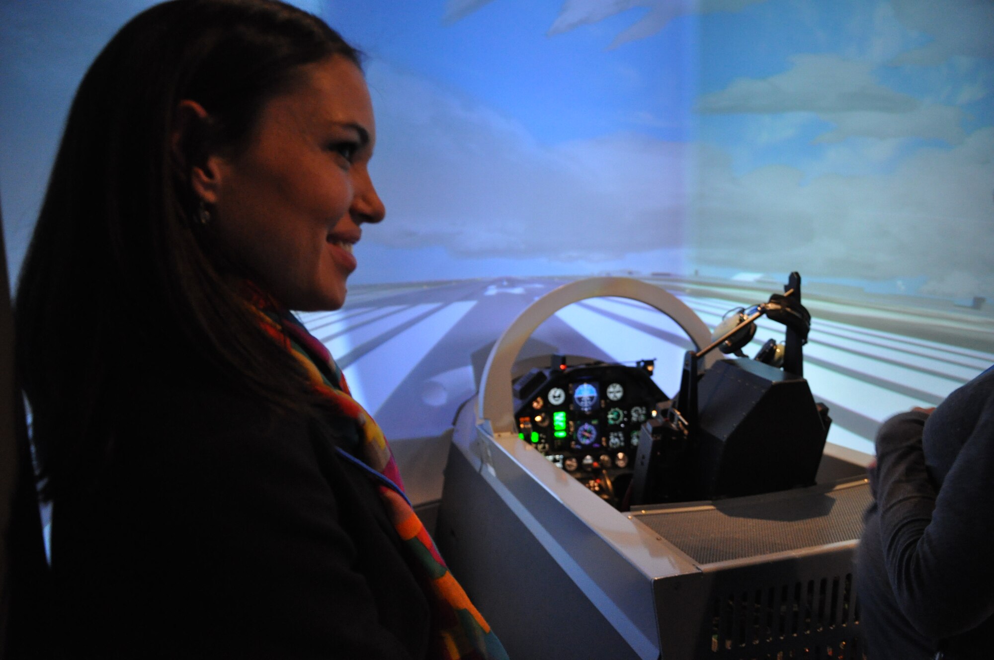 Maricela Saenz, Leadership Del Rio participant, experiences a T-6A Texan II simulator during a tour of Laughlin Air Force Base, Texas, Nov. 16, 2012. Leadership Del Rio is a program comprised of Team XL members and business and civic leaders from the city of Del Rio, Texas, that aims to develop stronger leaders for the community. (US Air Force photo/2nd Lt. Evan Ross)