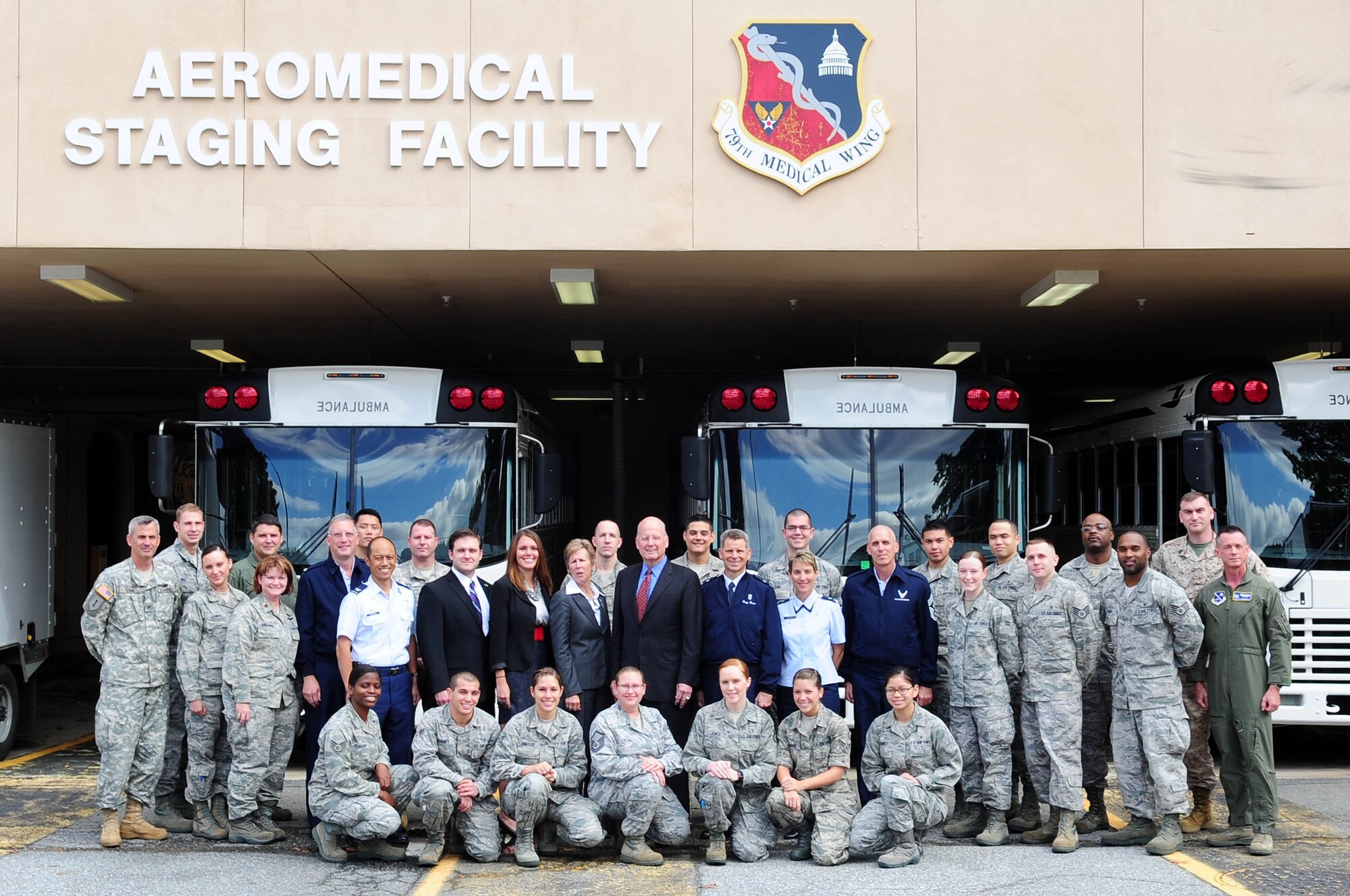 Military Officers Association of America and 79th Medical Wing team members gather for the 779th Medical Group Aeromedical Staging Facility's recent MOAA 2012 Community Heroes Award, Oct. 16, at Joint Base Andrews, Md. The 779th Medical Group Aeromedical Staging Facility team members were awarded the MOAA 2012 Community Heroes Award in the Military Caregivers category recently for their endless dedication to helping wounded warriors returning from overseas everyday at JBA. The award-winning ASF team members are made up of 12 permanent party members and 32 deployed members currently from military bases in Alaska, Ohio, Virginia, New Jersey and Texas. (U.S. Air Force photo by Senior Airman Steele C. G. Britton)