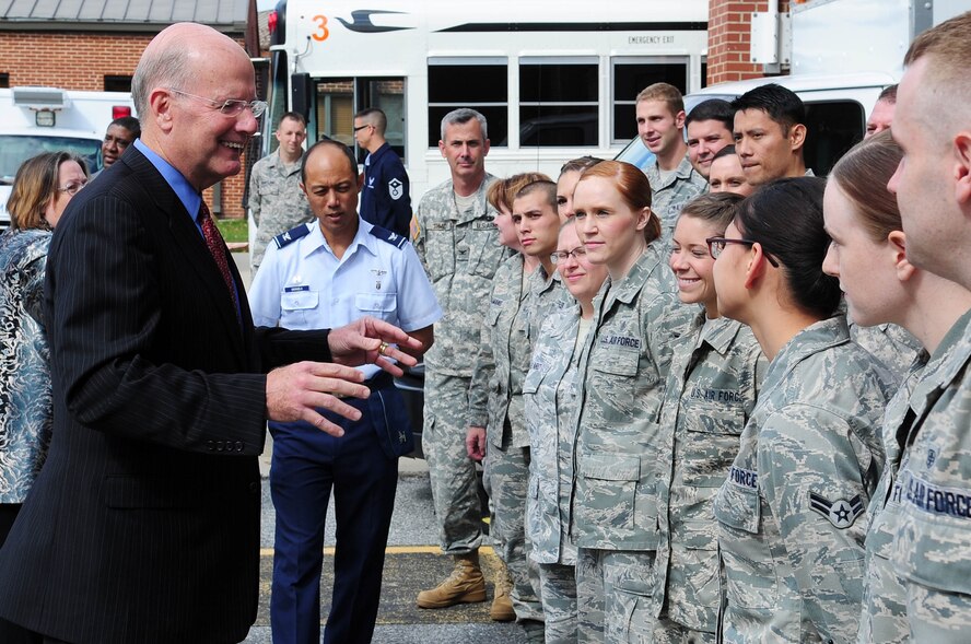 U.S. Navy Vice Admiral (ret.) Norb Ryan, Military Officers Association of America president, thanks 779th Medical Group Aeromedical Staging Facility Airmen for their dedication to helping others during a visit to the ASF, Oct. 16, at Joint Base Andrews, Md. The ASF is manned by a multiservice military team comprised of anesthesiologists, mental health care providers, flight surgeons, nurses, medical technicians, health service administrators, chaplains, dietary technicians and Marine Corps and Army liaisons. (U.S. Air Force photo by Senior Airman Steele C. G. Britton)