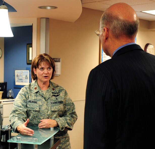 Maj. Nancy Salmans, 779th Medical Group Aeromedical Staging Facility commander, explains the duties of the ASF to U.S. Navy Vice Admiral (ret.) Norb Ryan, Military Officers Association of America president, during a visit to the facility, Oct. 16, at Joint Base Andrews, Md. ?Here, the patient is a priority, it doesn?t matter who is in the building--if there is a patient that needs something, everything drops and their needs are met,? said Salmans. (U.S. Air Force photo by Senior Airman Steele C. G. Britton)