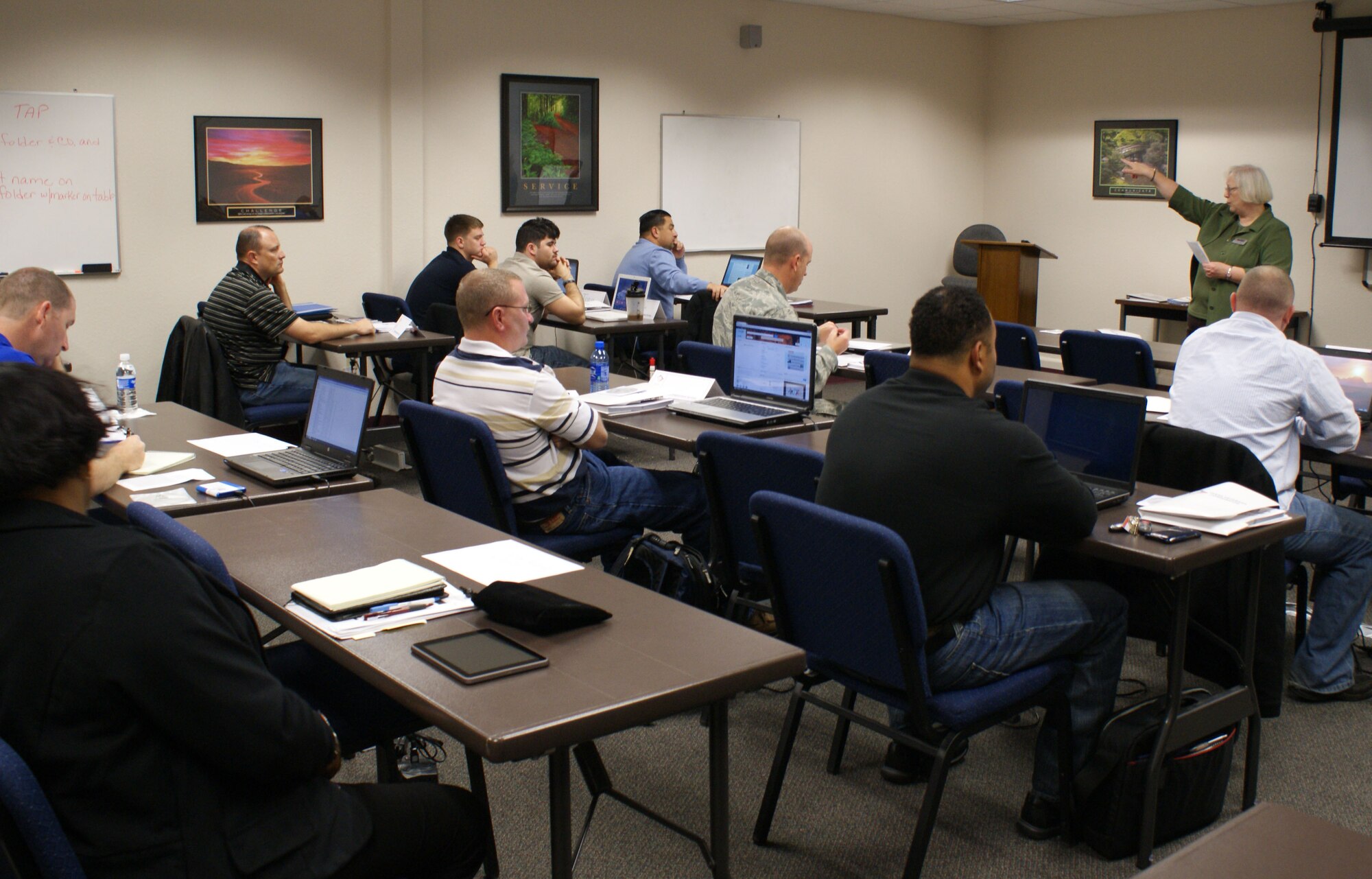 Linda Plummer (front of class), Transition Assistance Program (TAP) Core Compliance Expert at the Sheppard Air Force Base Airman & Family Readiness Center, speaks with transitioning service members during the first day of the revamped TAP course Nov. 26, 2012.  The new TAP seminar is now mandatory for retiring and separating service members.  (U.S. Air Force photo/Dan Hawkins)