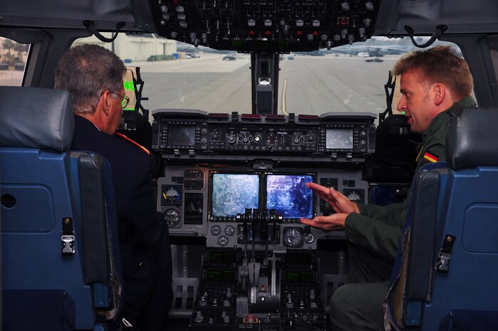 Brig. Gen. Hasso Koertge (left), commander of the German Armed Forces for United States and Canada, speaks with Maj. Sebastian Demitz, a German exchange pilot with the 14th Airlift Squadron, 437th Airlift Wing Nov. 20, 2012, at Joint Base Charleston – Air Base, S.C. Koertge was in Charleston to observe the interaction of Demitz with his U.S. Air Force counterparts, and how he was being utilized on missions. (U.S. Air Force photo/ Airman 1st Class Chacarra Walker)