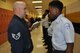 Staff Sgt. Garreth Laney, the training noncommissioned officer at the Readiness Management Group, inspects JROTC cadets at Twiggs County High School during an open ranks inspection after a Veterans Day Program Nov. 5. (Air Force photo by Capt Candice Allen)
