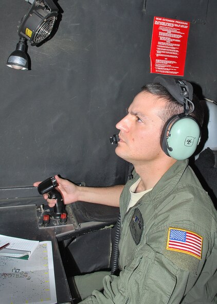 Staff Sgt. Justin Twilley, 16th Special Operations Squadron lowlight television operator, focuses intently on his job during an AC-130H Spectre gunship flight at Cannon Air Force Base, N.M., Nov. 8, 2012. The flight was part of a routine training mission conducted over White Sands Missile Range, N.M., in coordination with coalition forces both on the ground and in the air.(U.S. Air Force photo/Desiree Ann Montenegro)  