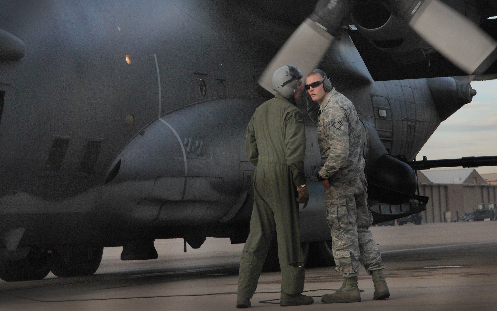 U.S. Air Force Senior Airman Aaron Hayes, 16th Special Operations Squadron, confirs with a maintenance  Air Commando as they check an aircraft prior to departure at Cannon Air Force Base, N.M., Nov. 8, 2012.The squadron flies the AC-130H Spectre gunship, a heavily armed aircraft designed for close air support, armed reconnaissance, interdiction, night search and rescue and airborne command and control.(U.S. Air Force photo/Desiree Ann Montenegro)  