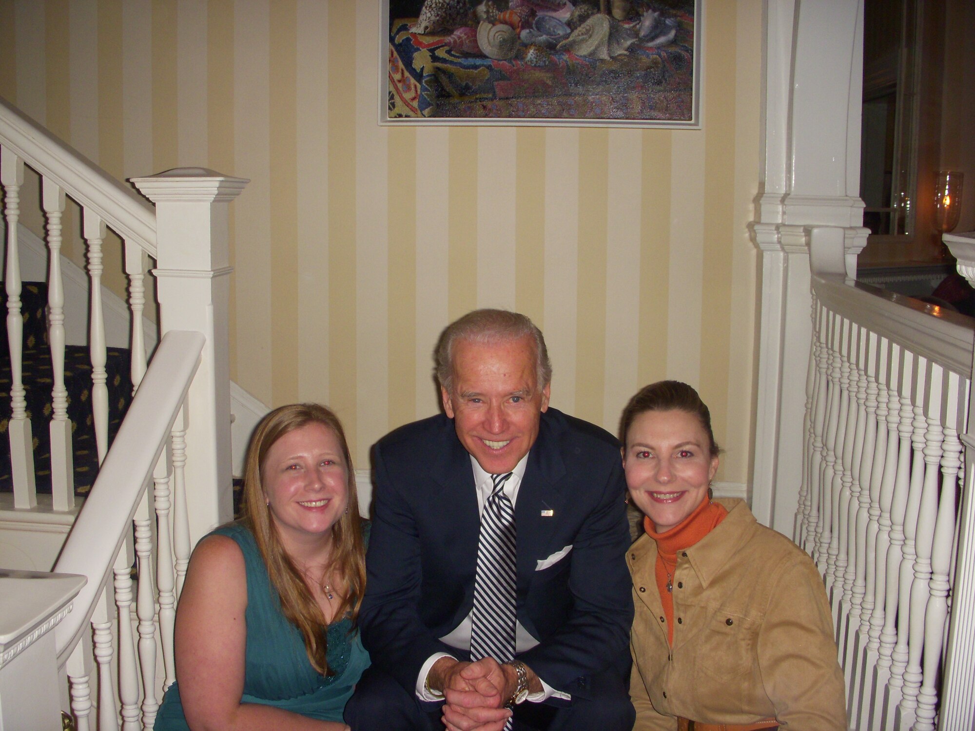 Individual mobilization augmentees Tech. Sgt. Lacey Smith (right) and Master Sgt. Mel Reich (left) smile for a photo with Vice President of the United States Joseph Biden during the Wounded Warrior Dinner Nov. 19 in Washington, D.C. Smith received the dinner invitation from Reich due to Lacey's dogged assistance over the last year tackling the member's medical issues. The vice president and his wife, Jill, host this annual event which honors wounded warriors being treated at Walter Reed National Military Medical Center and their families who are unable to leave the DC area for Thanksgiving. (Courtesy photo)