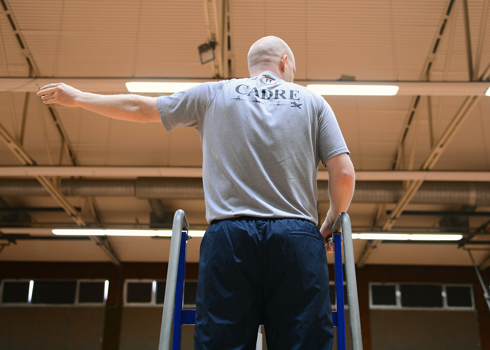 SPANGDAHLEM AIR BASE, Germany – U.S. Air Force Staff Sgt. Michael Baker, 52nd Force Support Squadron Airman Leadership School instructor, referees for the traditional first sergeant versus ALS student volleyball game at the Skelton Memorial Fitness Center Nov. 21. Each flight of the school house competes against the shirt team, and an all-star match ends the tournament. (U.S. Air Force photo by Staff Sgt. Daryl Knee/Released)