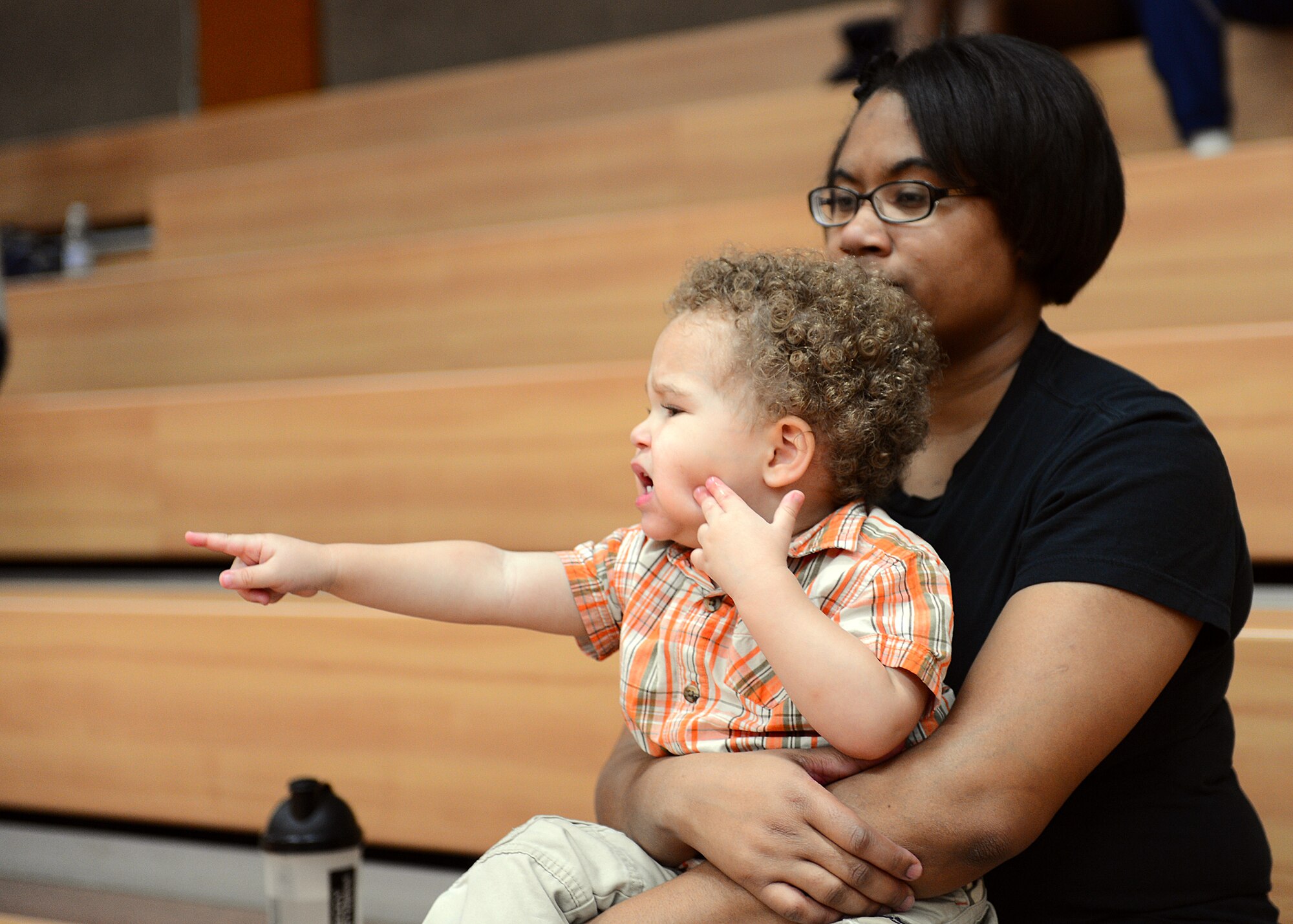SPANGDAHLEM AIR BASE, Germany – Sophia and Joshua Baker, wife and child of Staff Sgt. Michael Baker, 52nd Force Support Squadron Airman Leadership School instructor, watch the first sergeant versus ALS student volleyball game at the Skelton Memorial Fitness Center Nov. 21. The volley ball game is a tradition of the Pitsenbarger ALS where each class’ students learn teamwork and communication skills while battling the well-practiced first sergeants. The first sergeants continued their reign by winning 3-2 matches. (U.S. Air Force photo by Staff Sgt. Daryl Knee/Released)